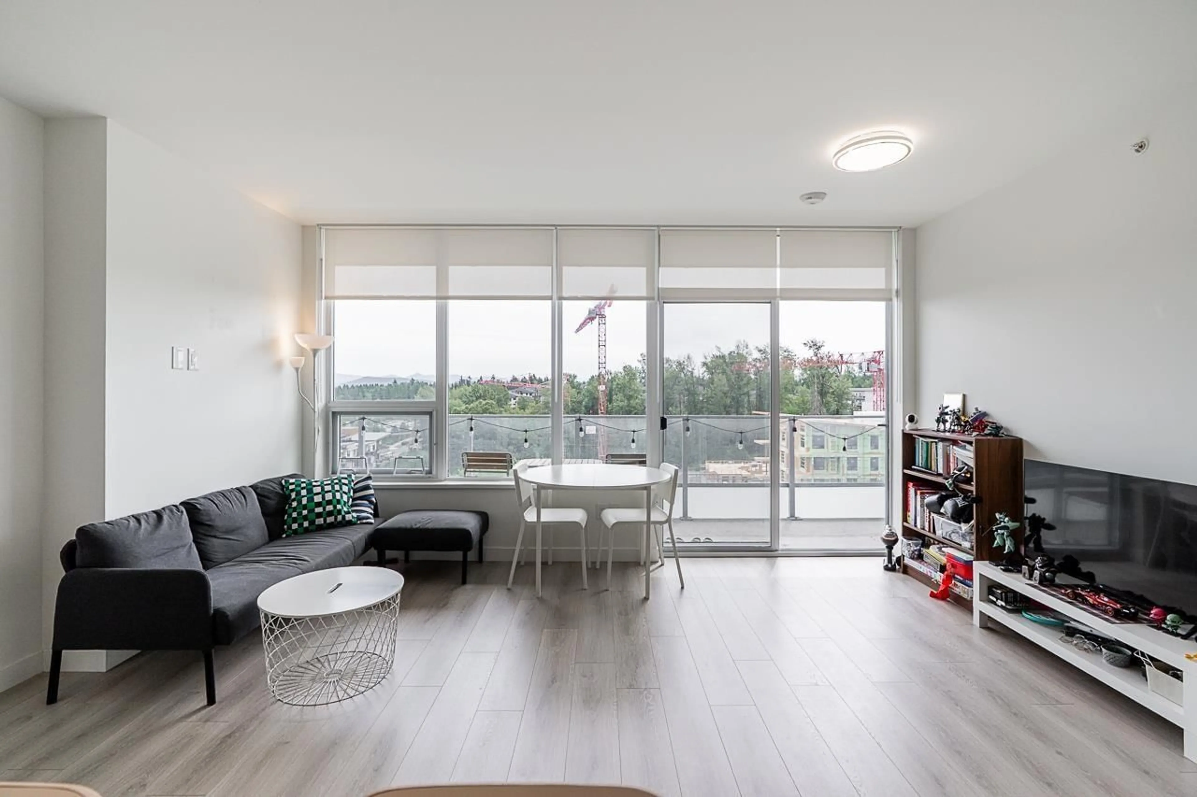 Living room with furniture, wood/laminate floor for 901 - 8551 201 STREET, Langley British Columbia V2Y3Y5