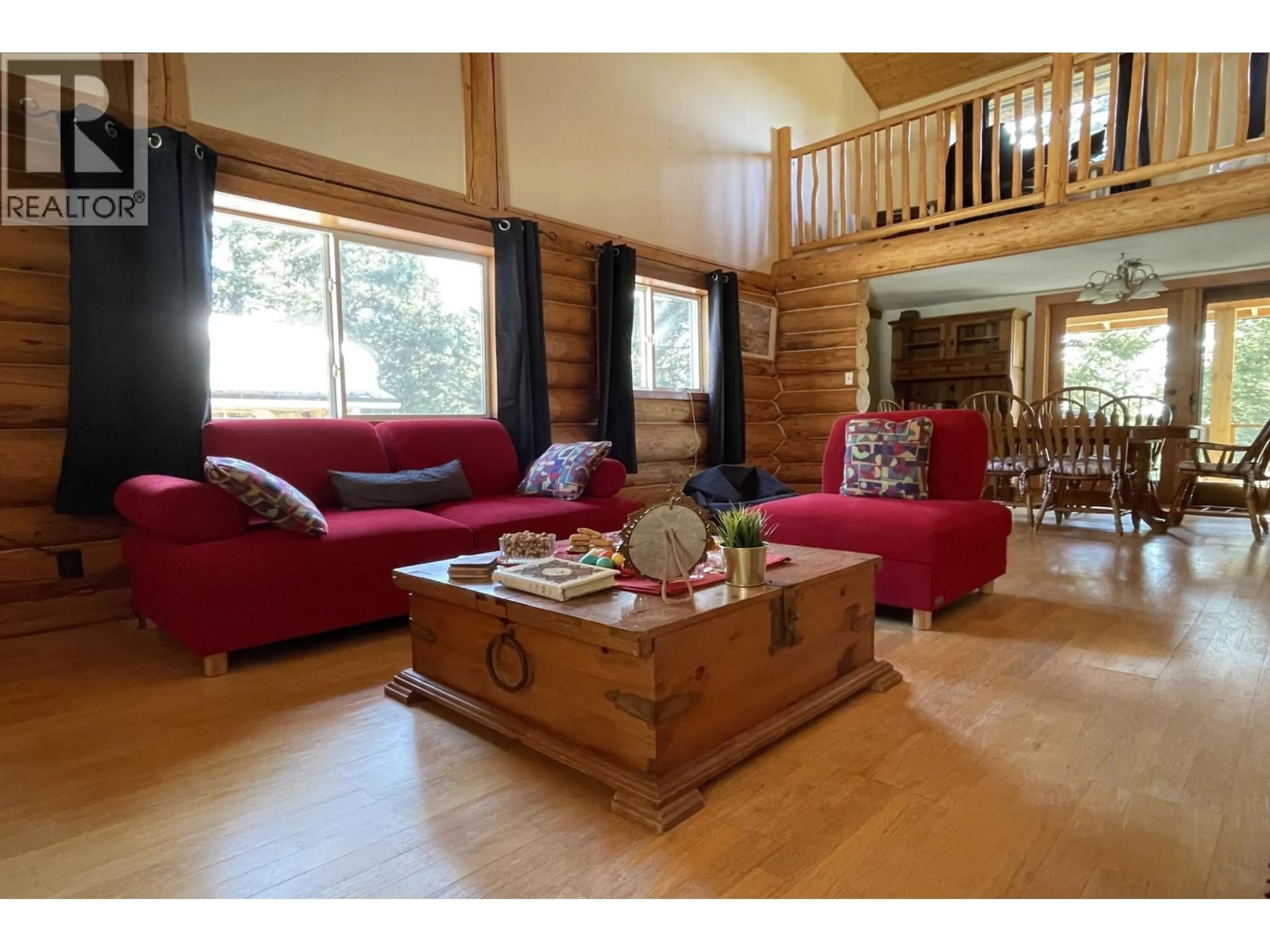 Living room with furniture, wood/laminate floor for 7755 LITTLE FORT 24 HIGHWAY, 100 Mile House British Columbia V0K1X2