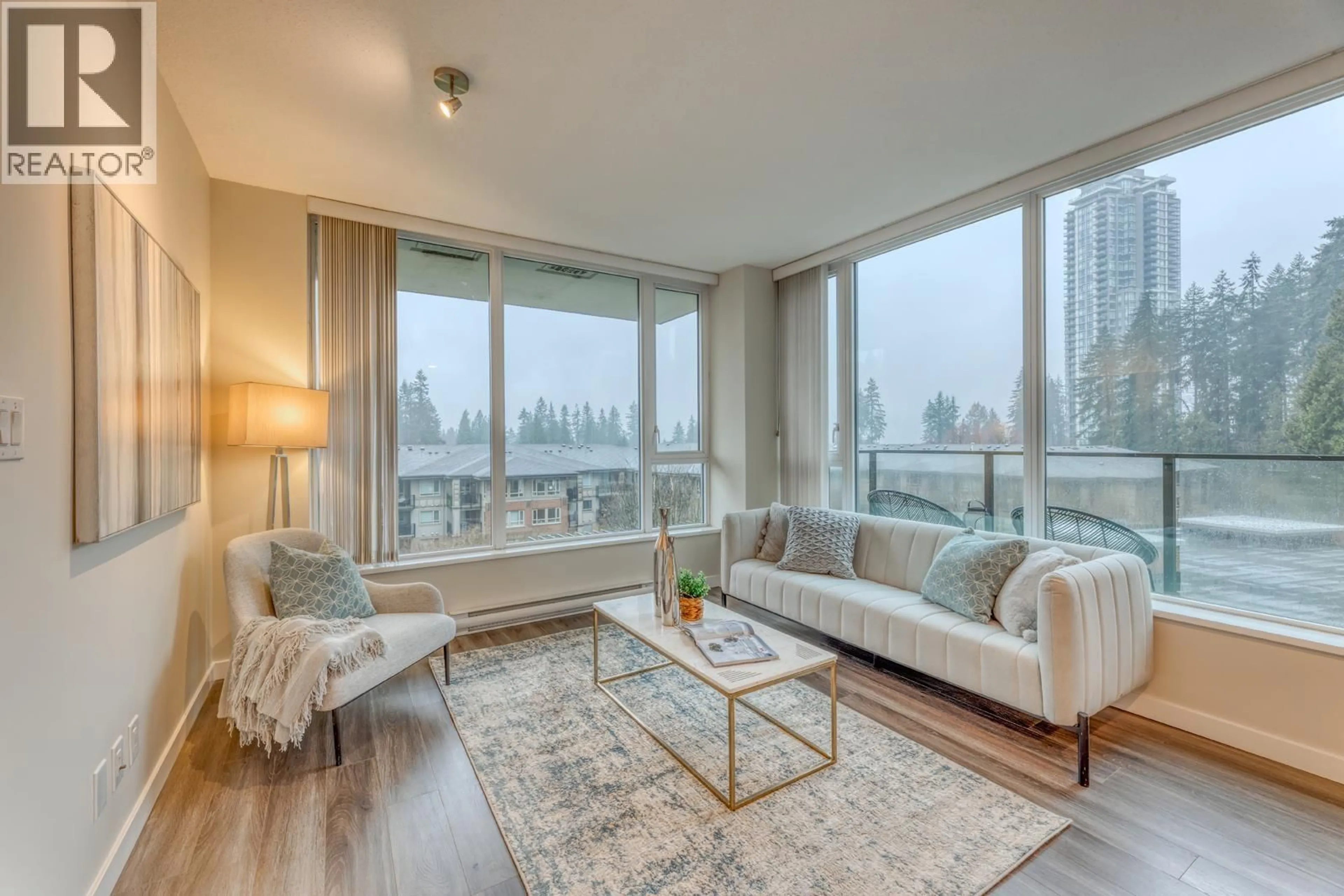 Living room with furniture, wood/laminate floor for 403 - 3100 WINDSOR GATE, Coquitlam British Columbia V3B0P3