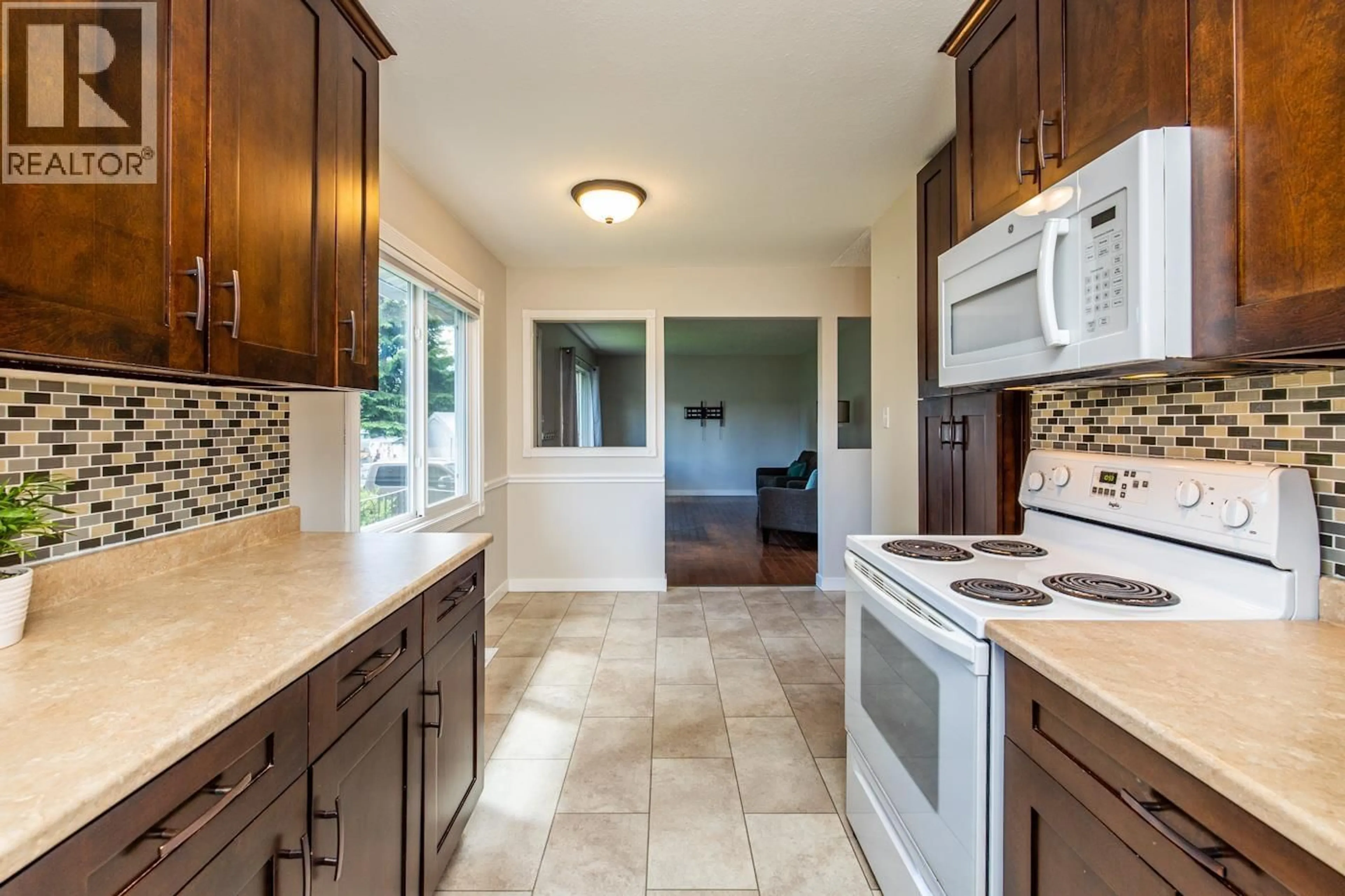 Open concept kitchen, ceramic/tile floor for 7889 QUEENS CRESCENT, Prince George British Columbia V2N3H5