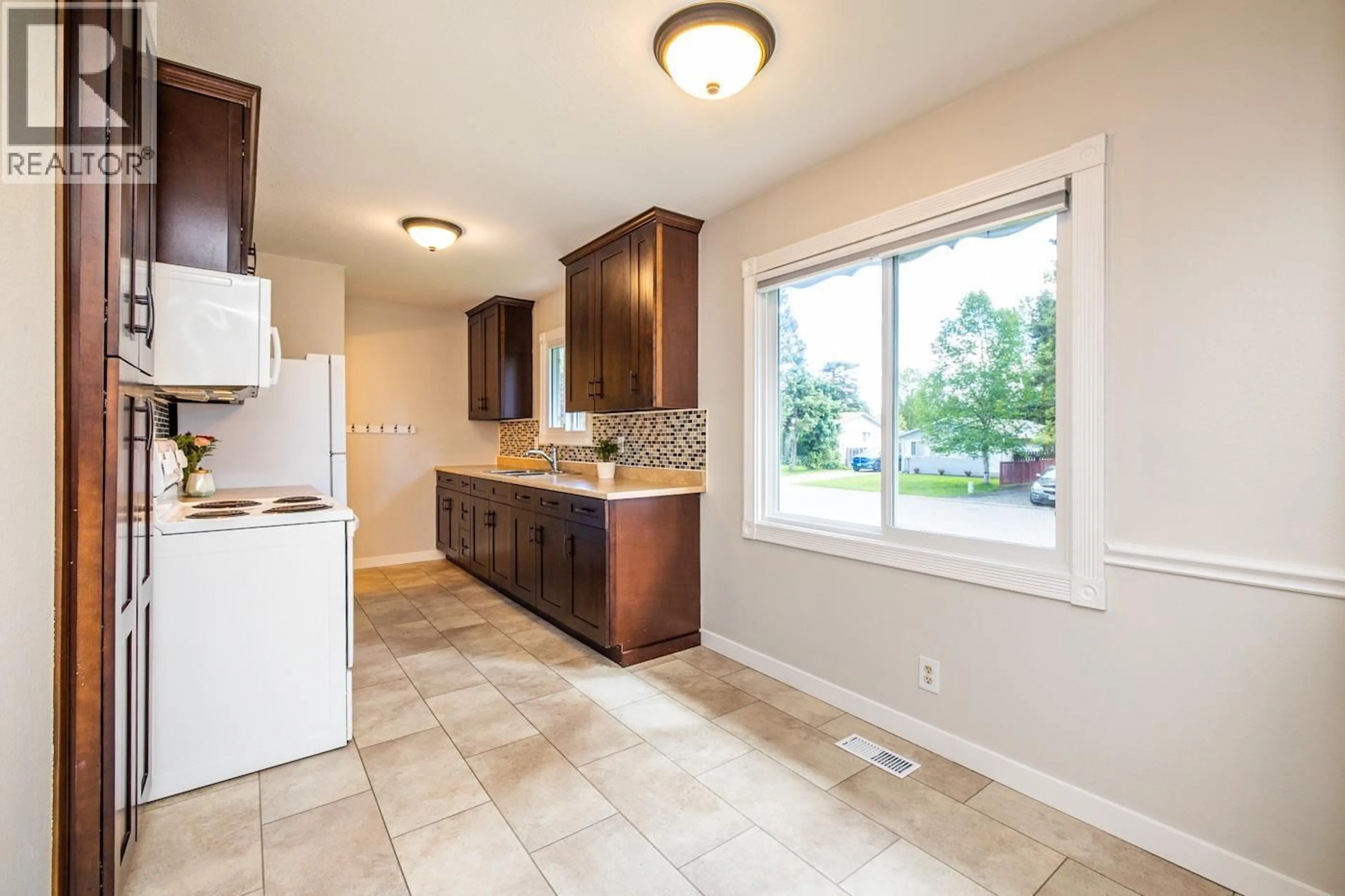 Open concept kitchen, ceramic/tile floor for 7889 QUEENS CRESCENT, Prince George British Columbia V2N3H5