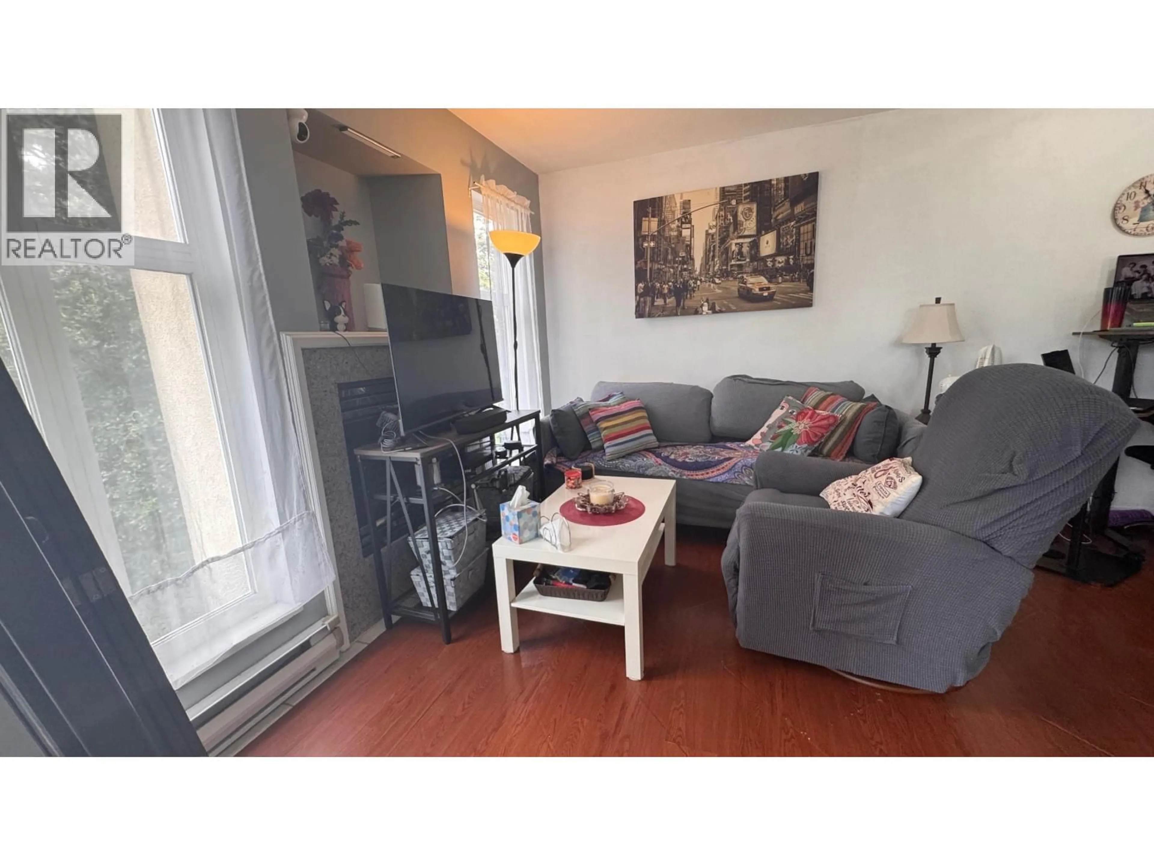 Living room with furniture, wood/laminate floor for 301 - 1099 71ST AVENUE, Vancouver British Columbia V6P6Y5