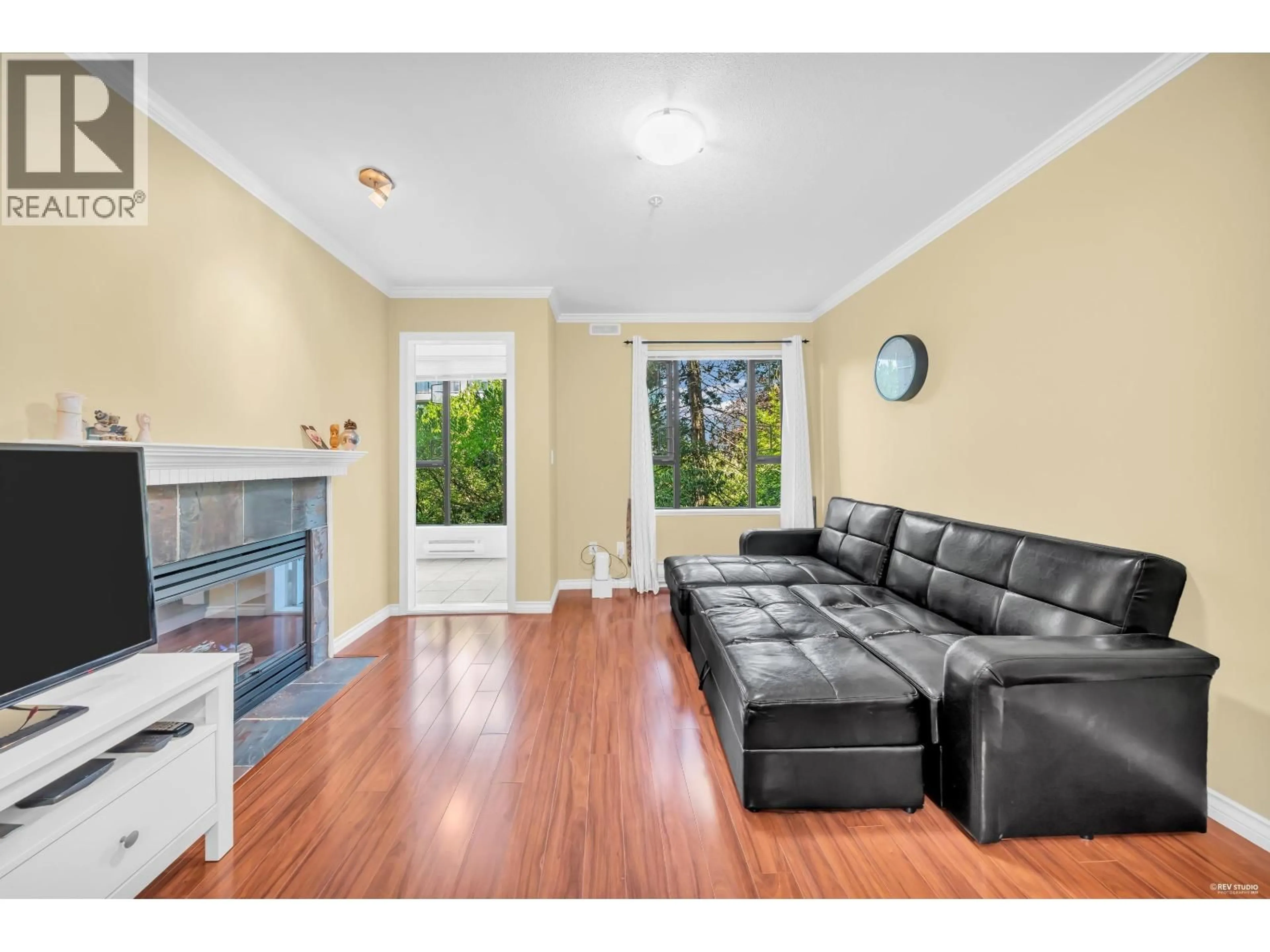 Living room with furniture, wood/laminate floor for 210 - 175 10TH STREET, North Vancouver British Columbia V7L4W1