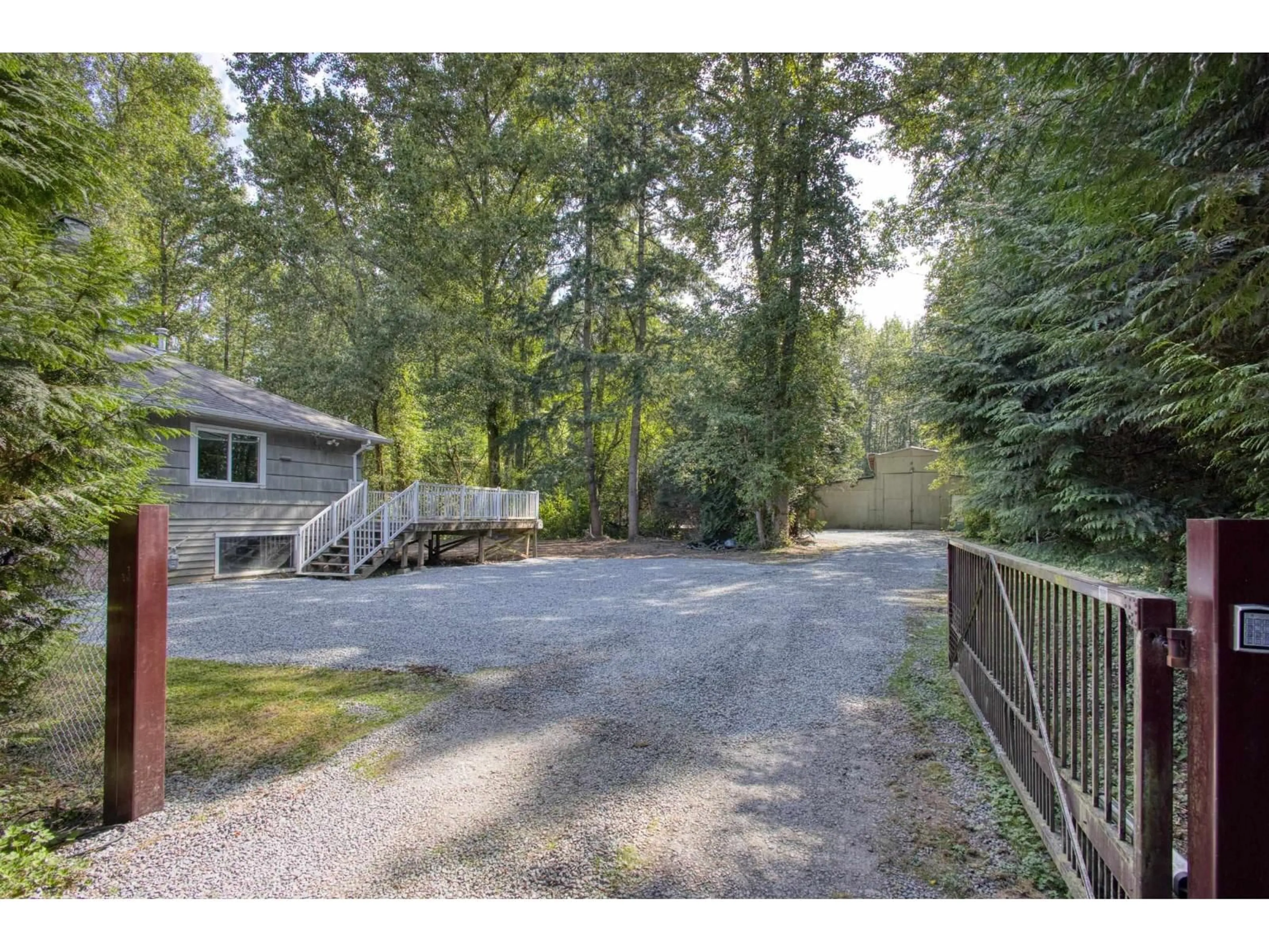 A pic from outside/outdoor area/front of a property/back of a property/a pic from drone, forest/trees view for 5860 256 STREET, Langley British Columbia V4W1J9
