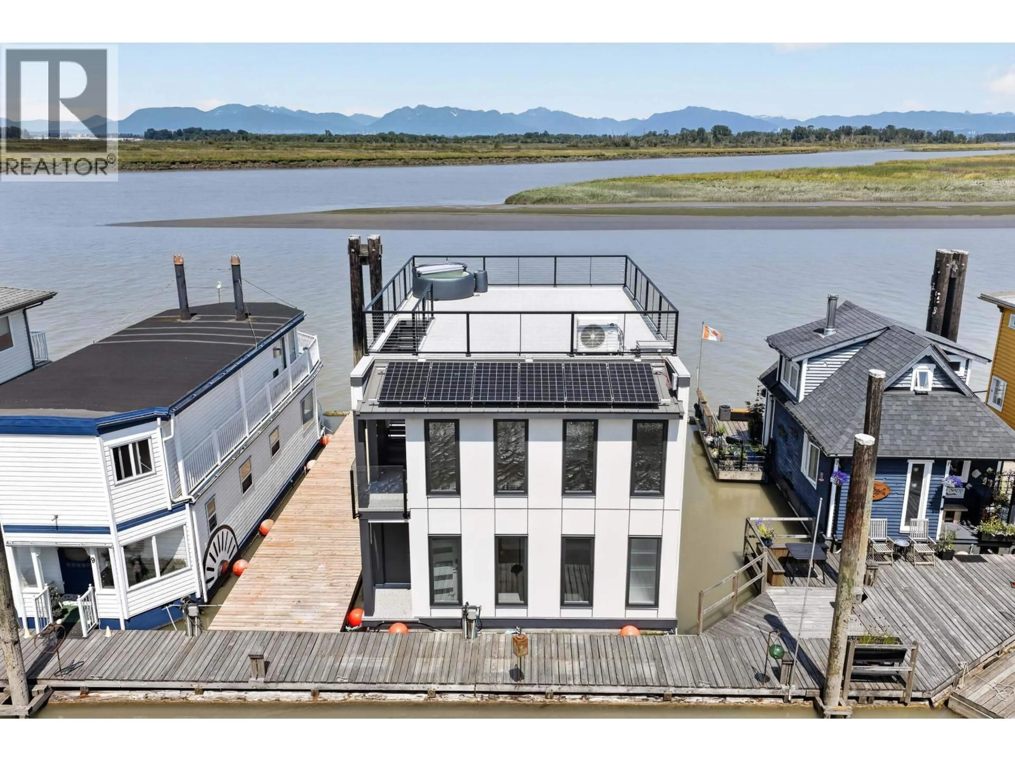 A pic from outside/outdoor area/front of a property/back of a property/a pic from drone, water/lake/river/ocean view for 10 - 3871 RIVER ROAD, Delta British Columbia V4K5E9