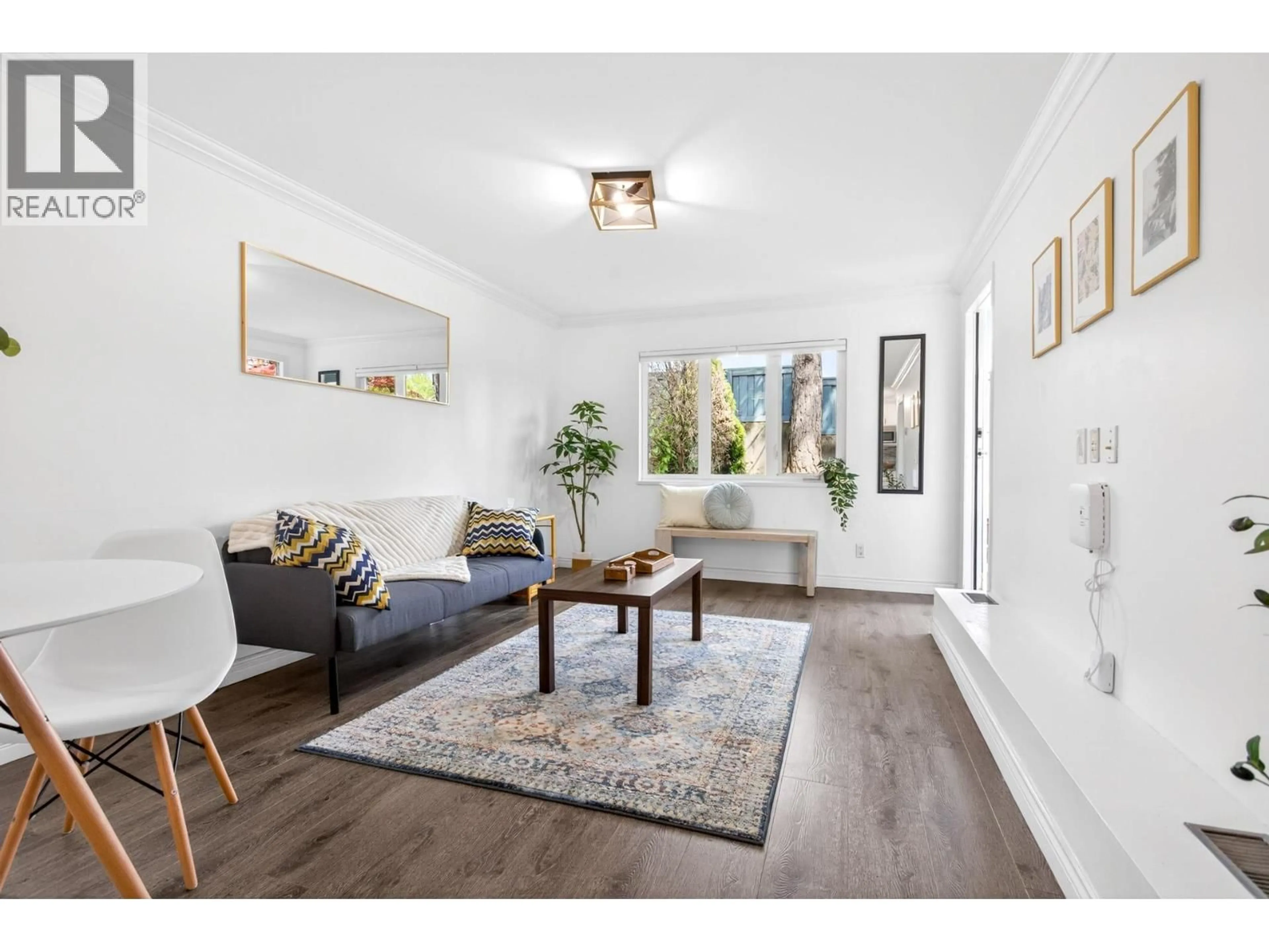 Living room with furniture, wood/laminate floor for 105 - 1122 KING ALBERT AVENUE, Coquitlam British Columbia V3J1X7