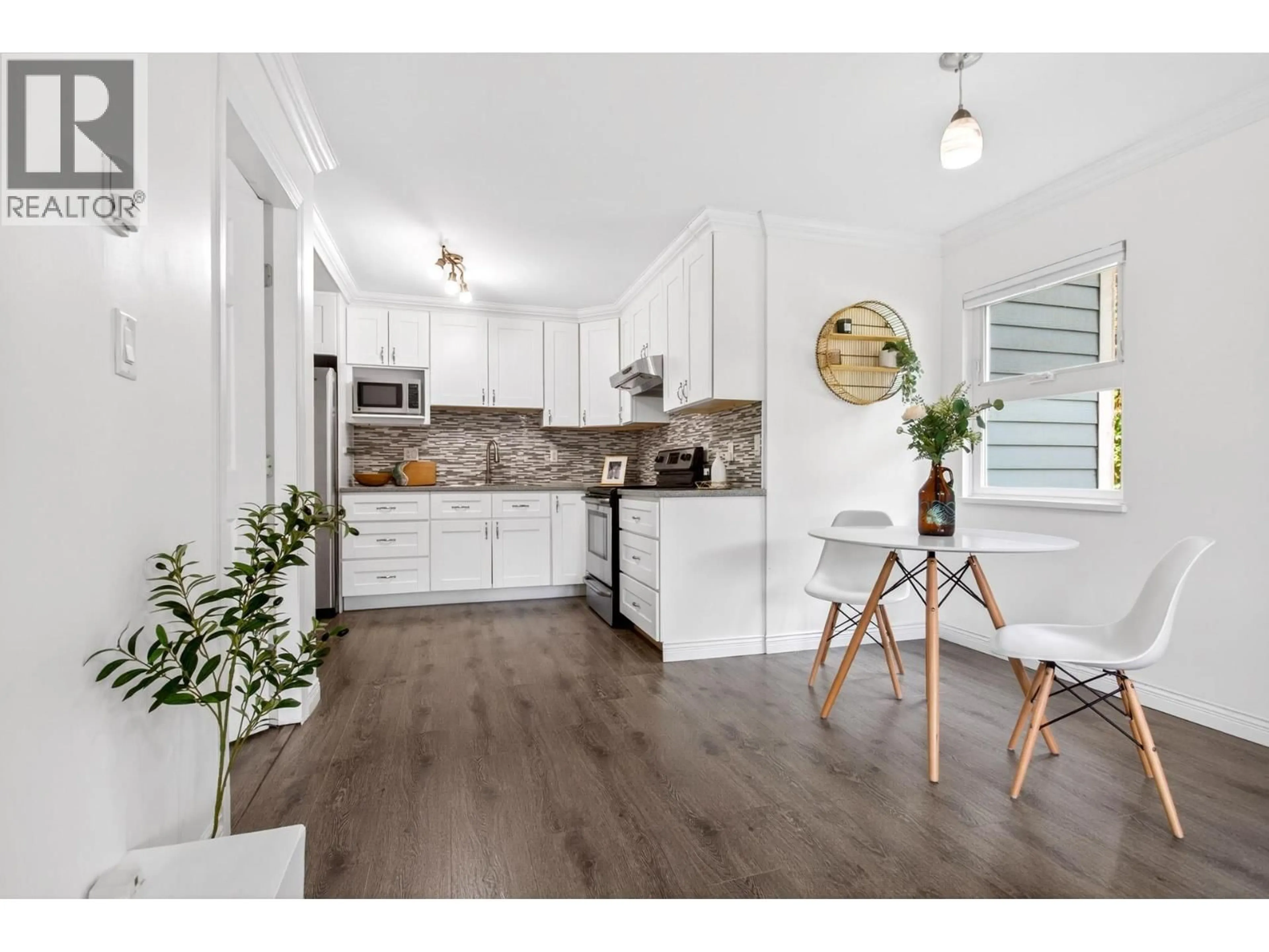 Open concept kitchen, wood/laminate floor for 105 - 1122 KING ALBERT AVENUE, Coquitlam British Columbia V3J1X7