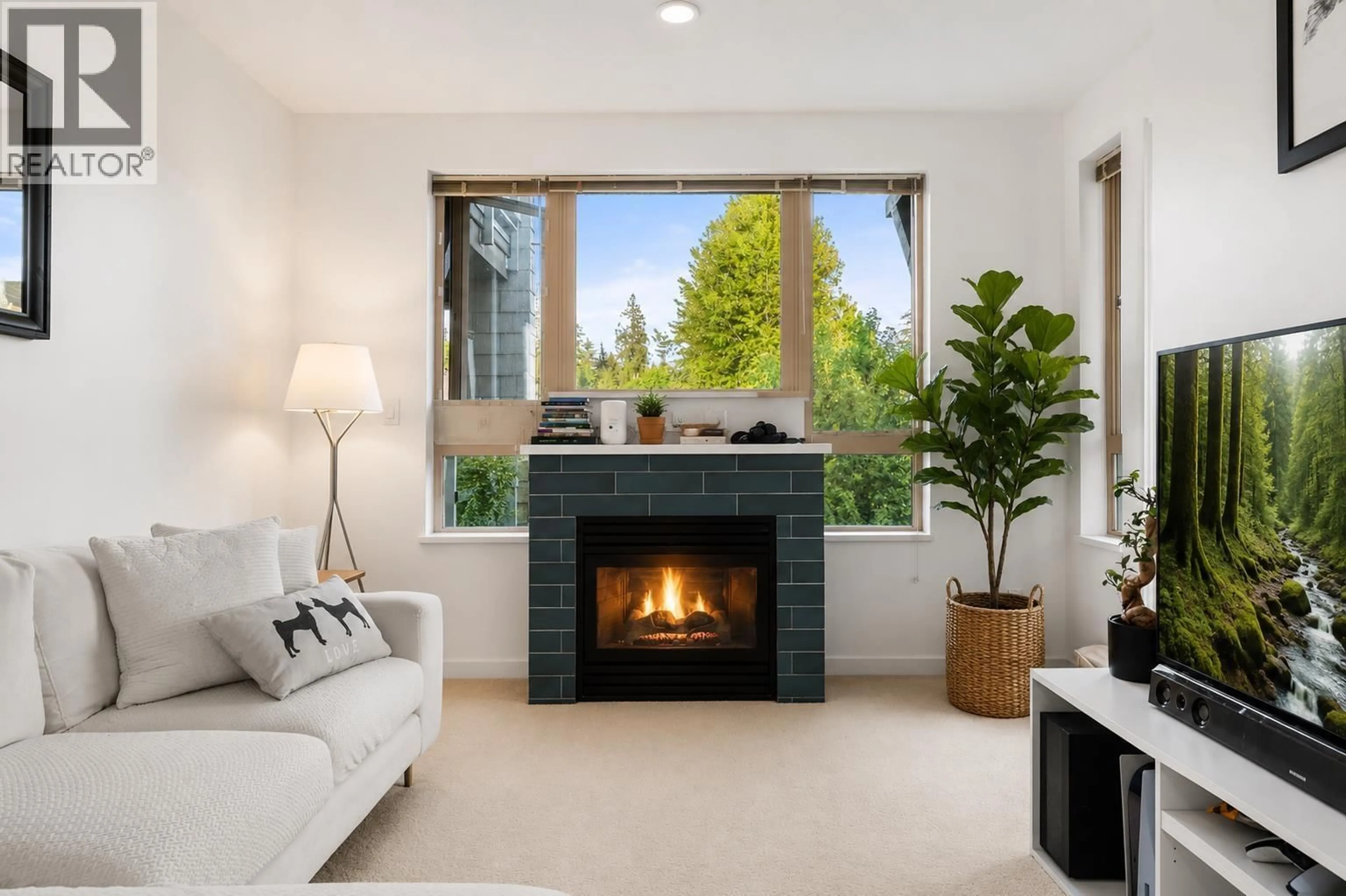 Living room with furniture, ceramic/tile floor for 317 - 530 RAVEN WOODS DRIVE, North Vancouver British Columbia V7G2T5