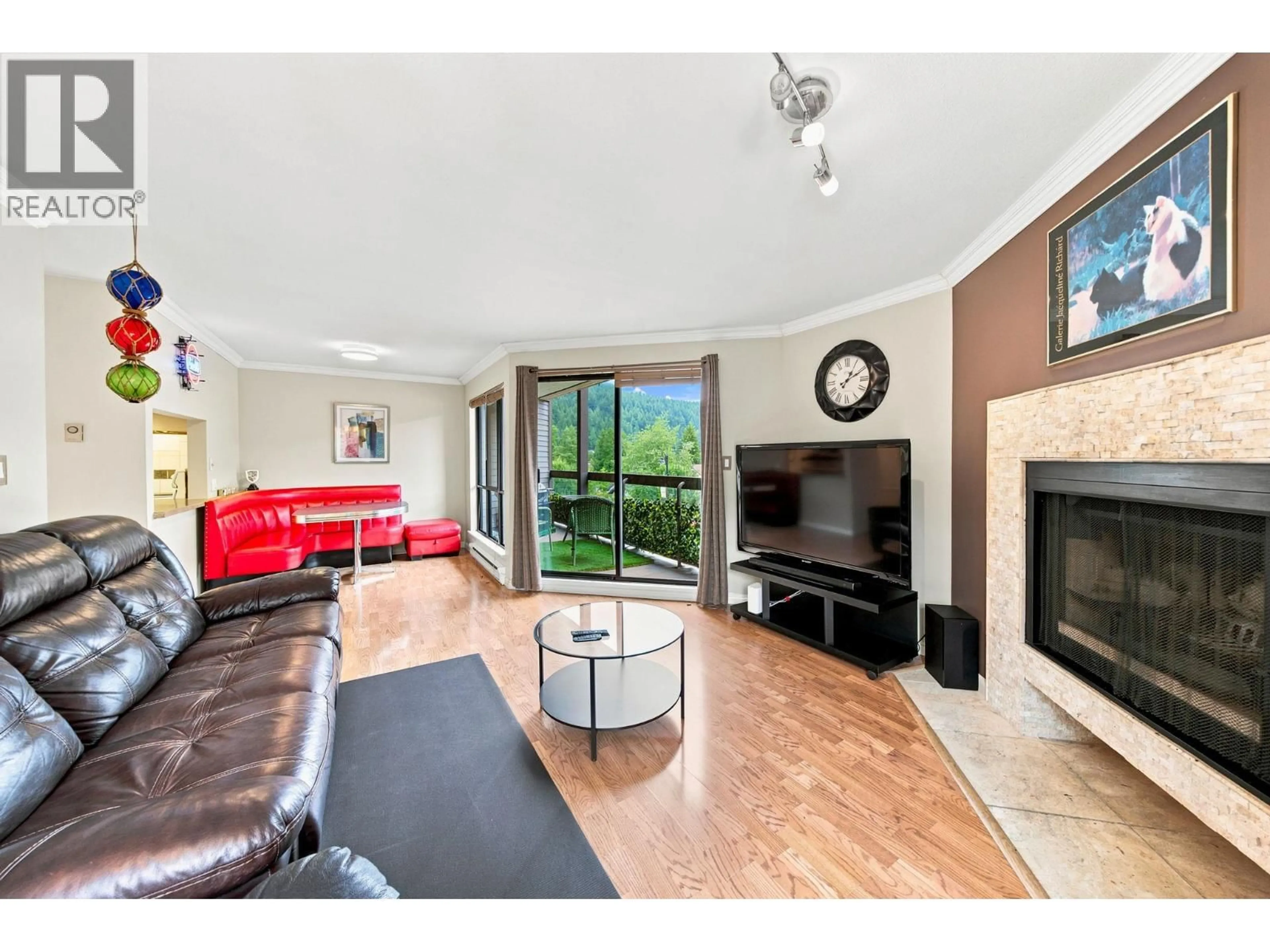 Living room with furniture, wood/laminate floor for 104 - 2181 PANORAMA DRIVE, North Vancouver British Columbia V7G1V3