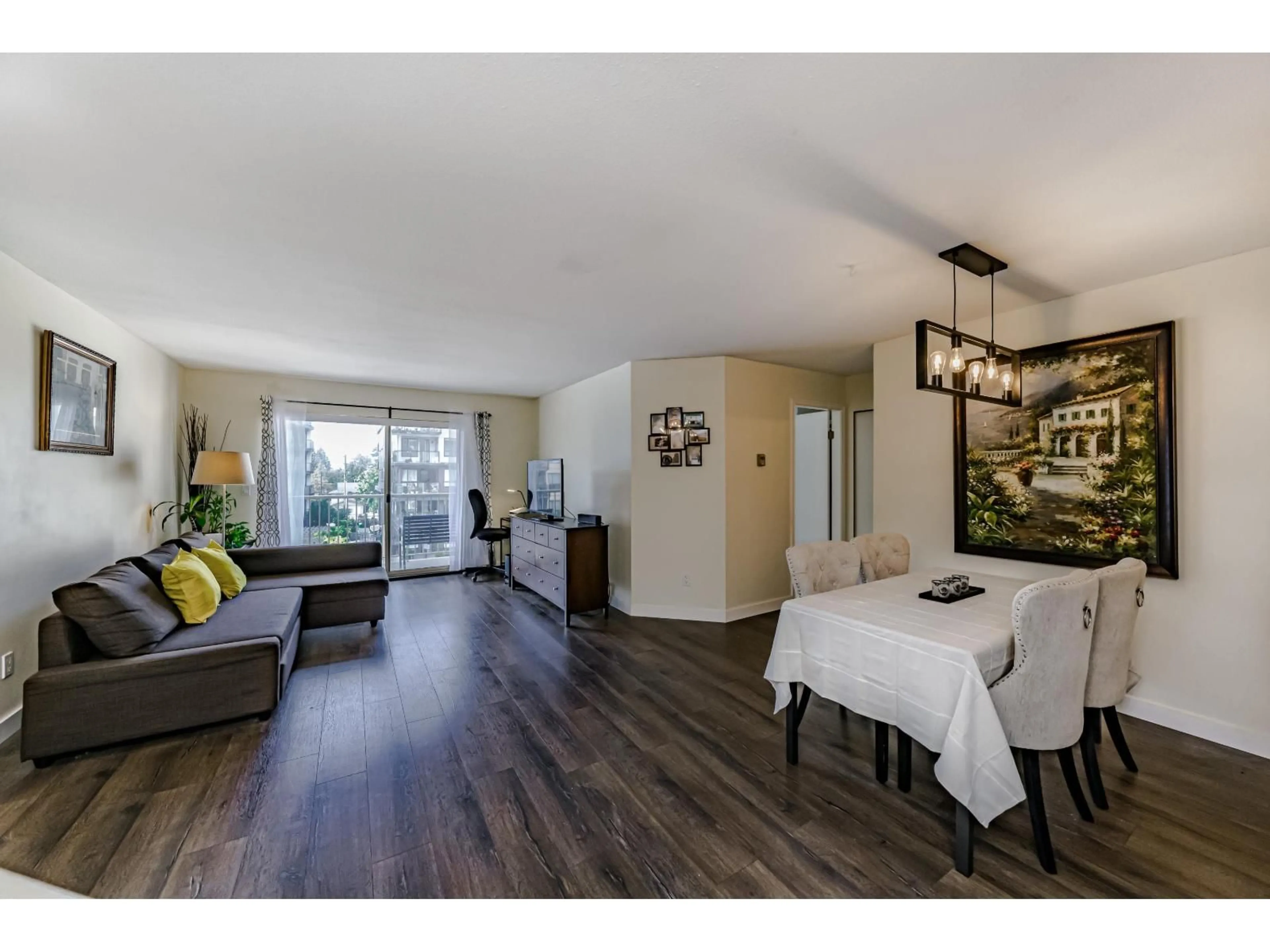 Living room with furniture, wood/laminate floor for 315 - 10756 138 STREET, Surrey British Columbia V3T4K5