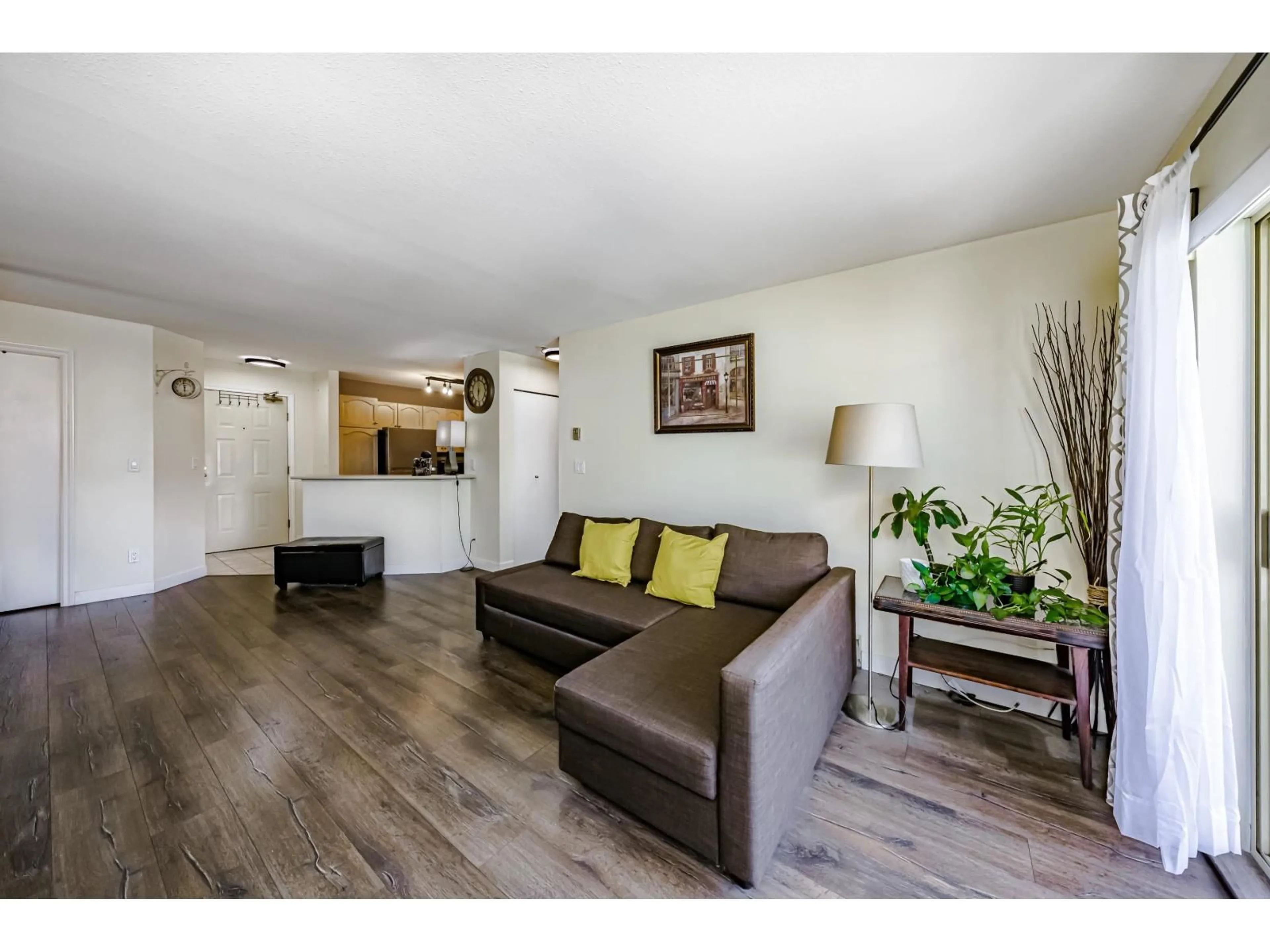 Living room with furniture, wood/laminate floor for 315 - 10756 138 STREET, Surrey British Columbia V3T4K5