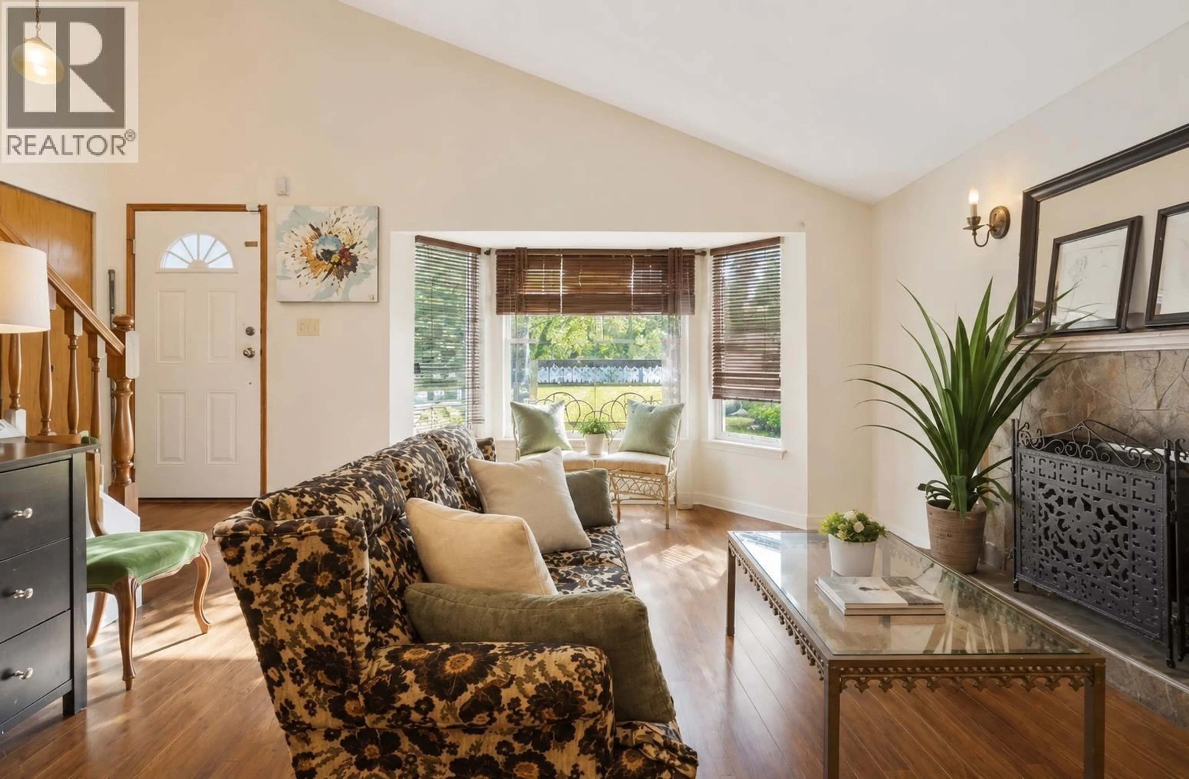 Living room with furniture, wood/laminate floor for 875 PORTEAU PLACE, North Vancouver British Columbia V7H2P8