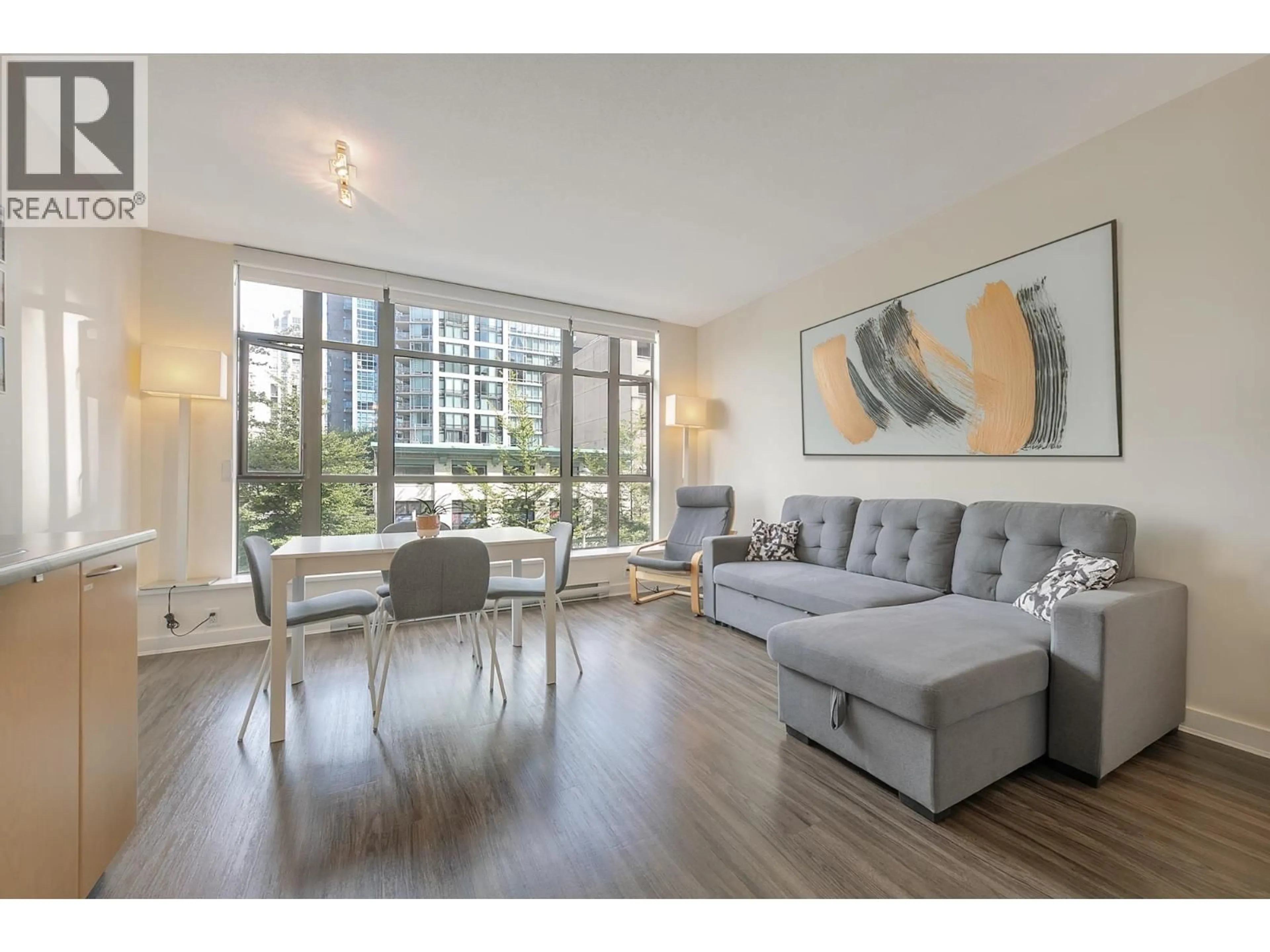 Living room with furniture, wood/laminate floor for 307 - 1249 GRANVILLE STREET, Vancouver British Columbia V6Z1M5