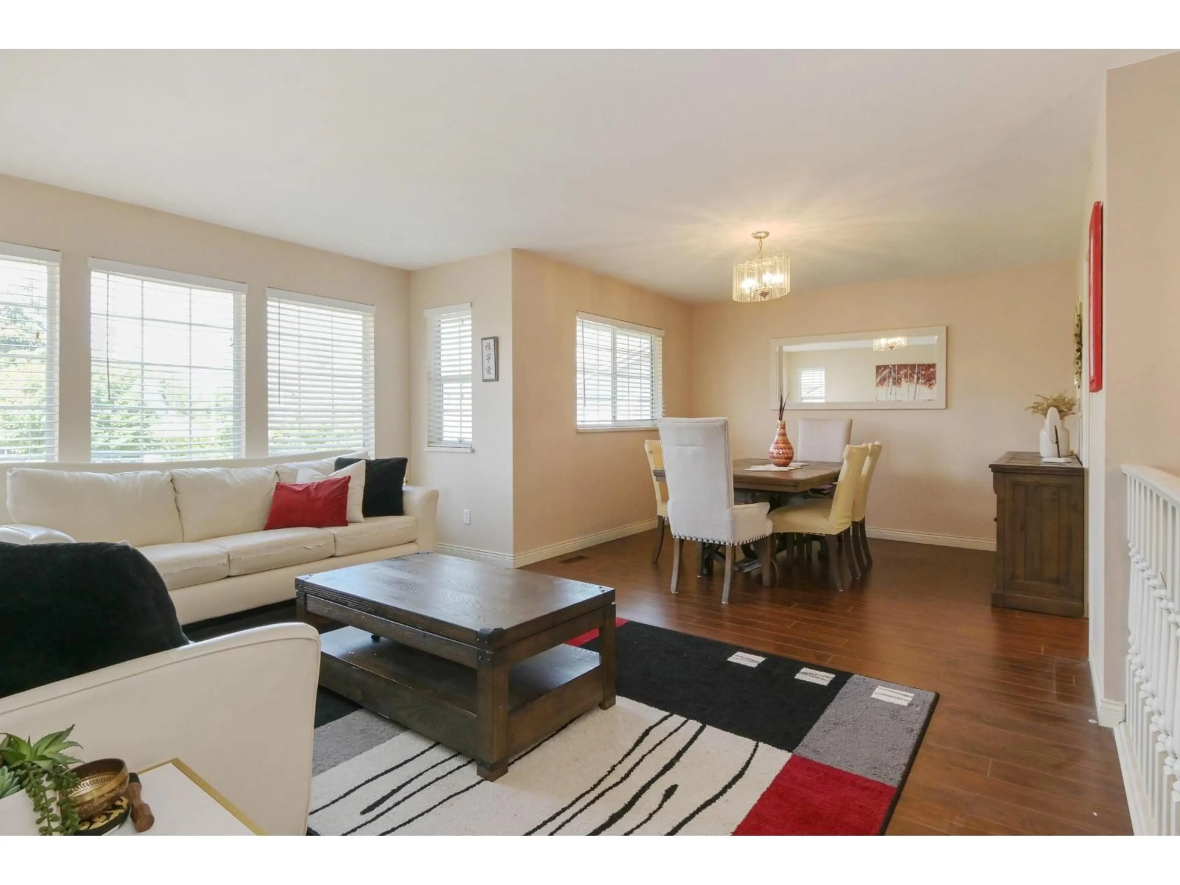 Living room with furniture, wood/laminate floor for 6084 185 STREET, Surrey British Columbia V3S7P7