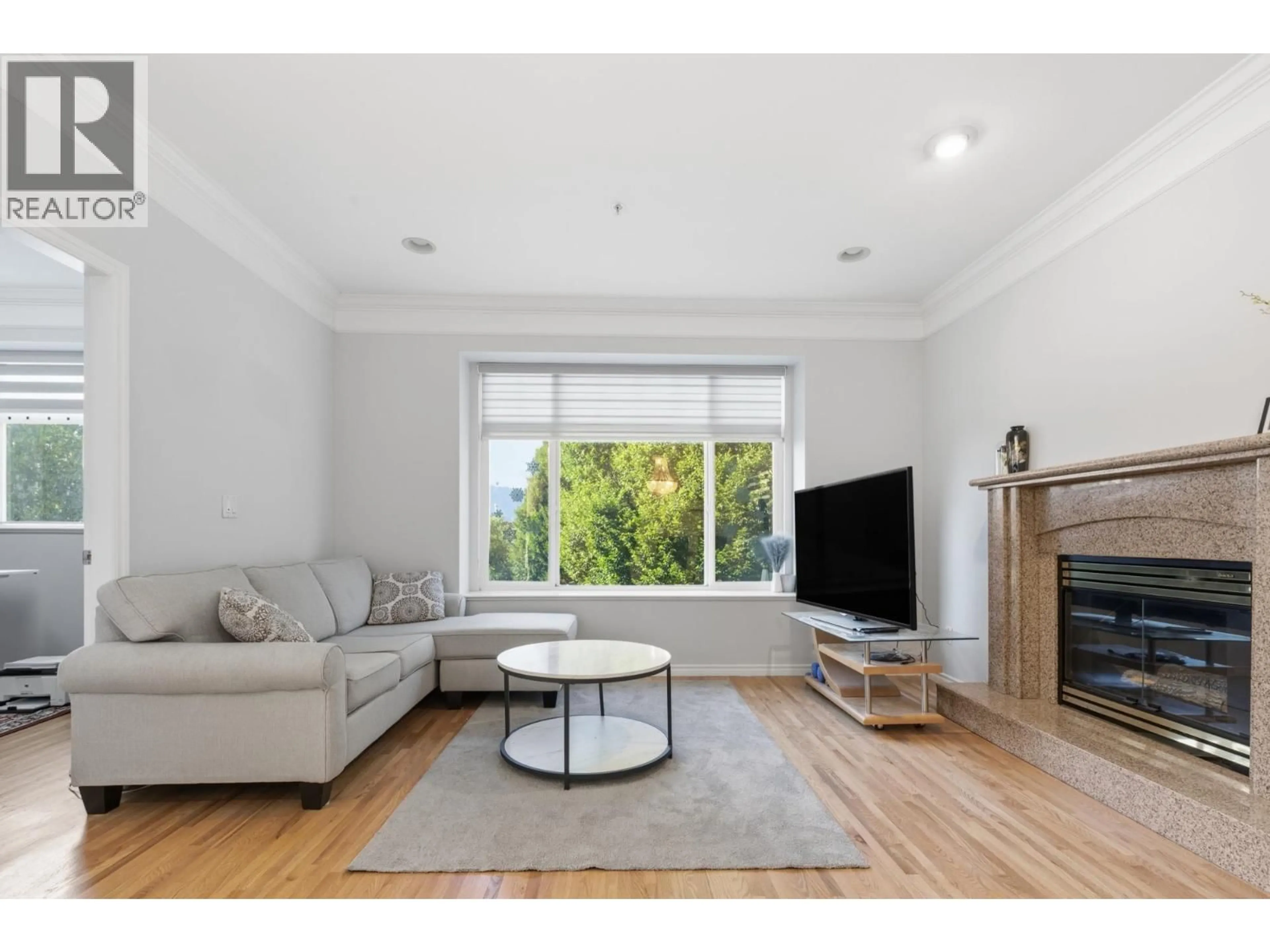 Living room with furniture, wood/laminate floor for 3186 18TH AVENUE, Vancouver British Columbia V5M2R5