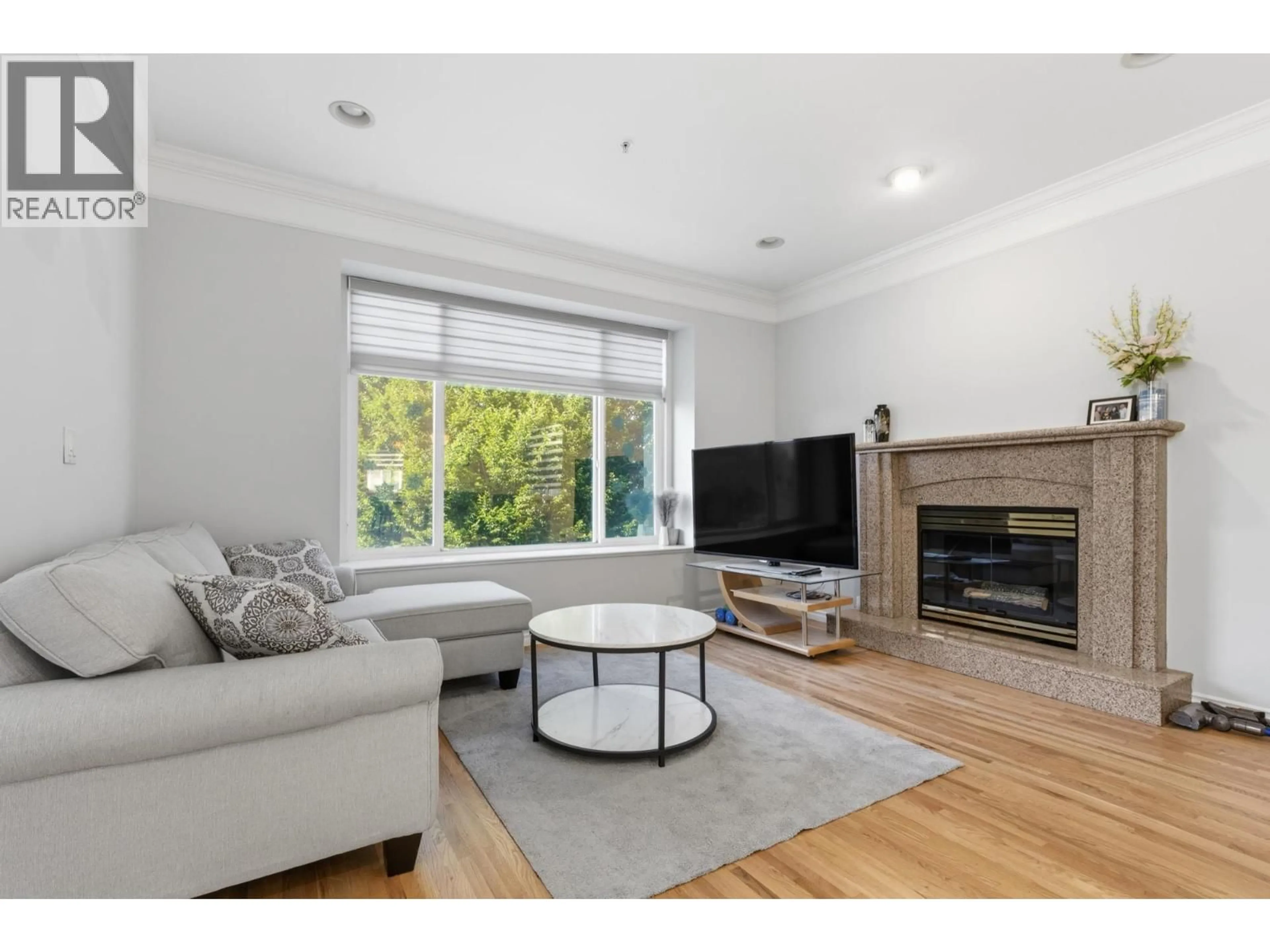 Living room with furniture, wood/laminate floor for 3186 18TH AVENUE, Vancouver British Columbia V5M2R5
