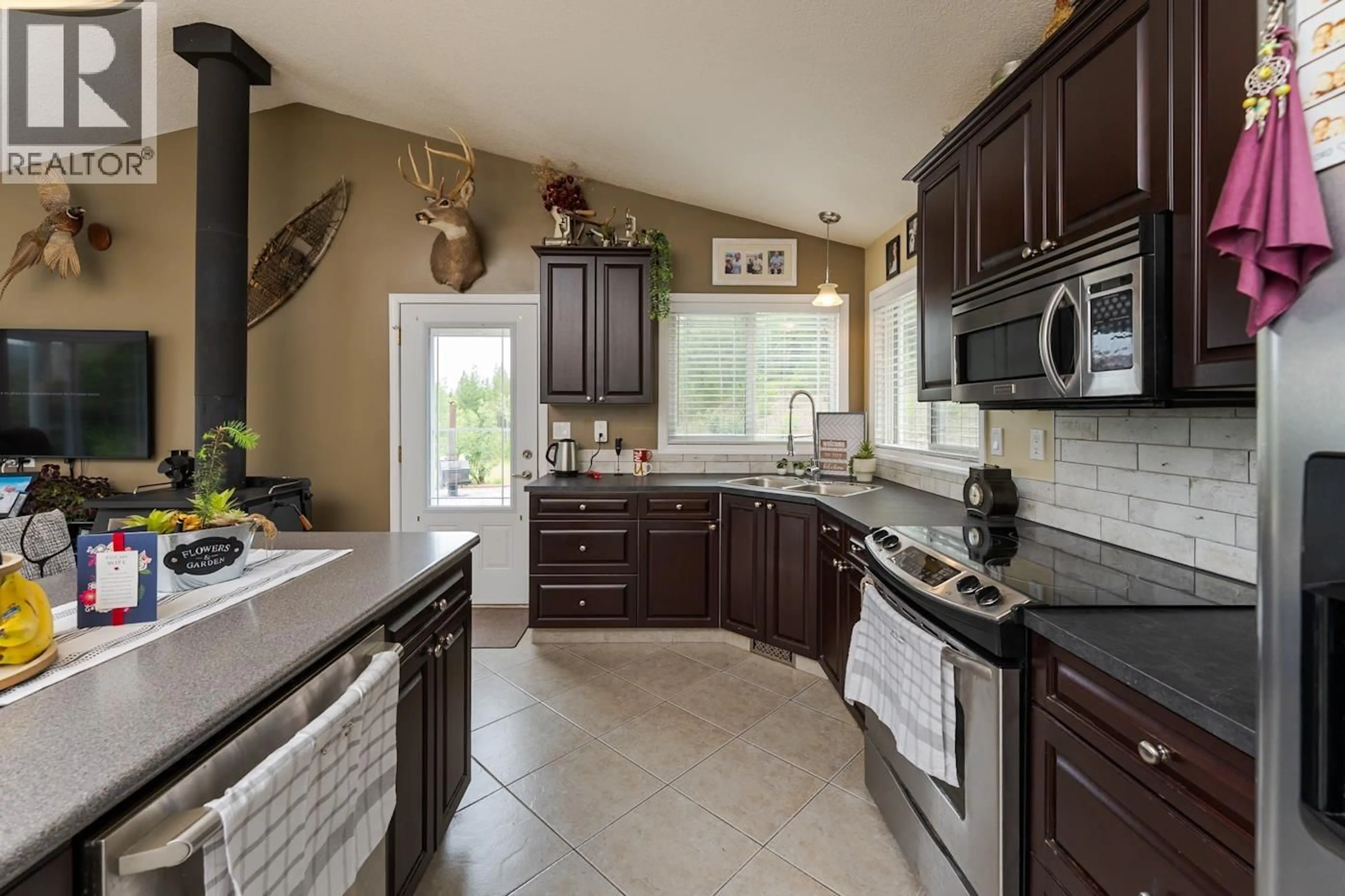 Open concept kitchen, ceramic/tile floor for 25800 WEST LAKE ROAD, Prince George British Columbia V2N6H6