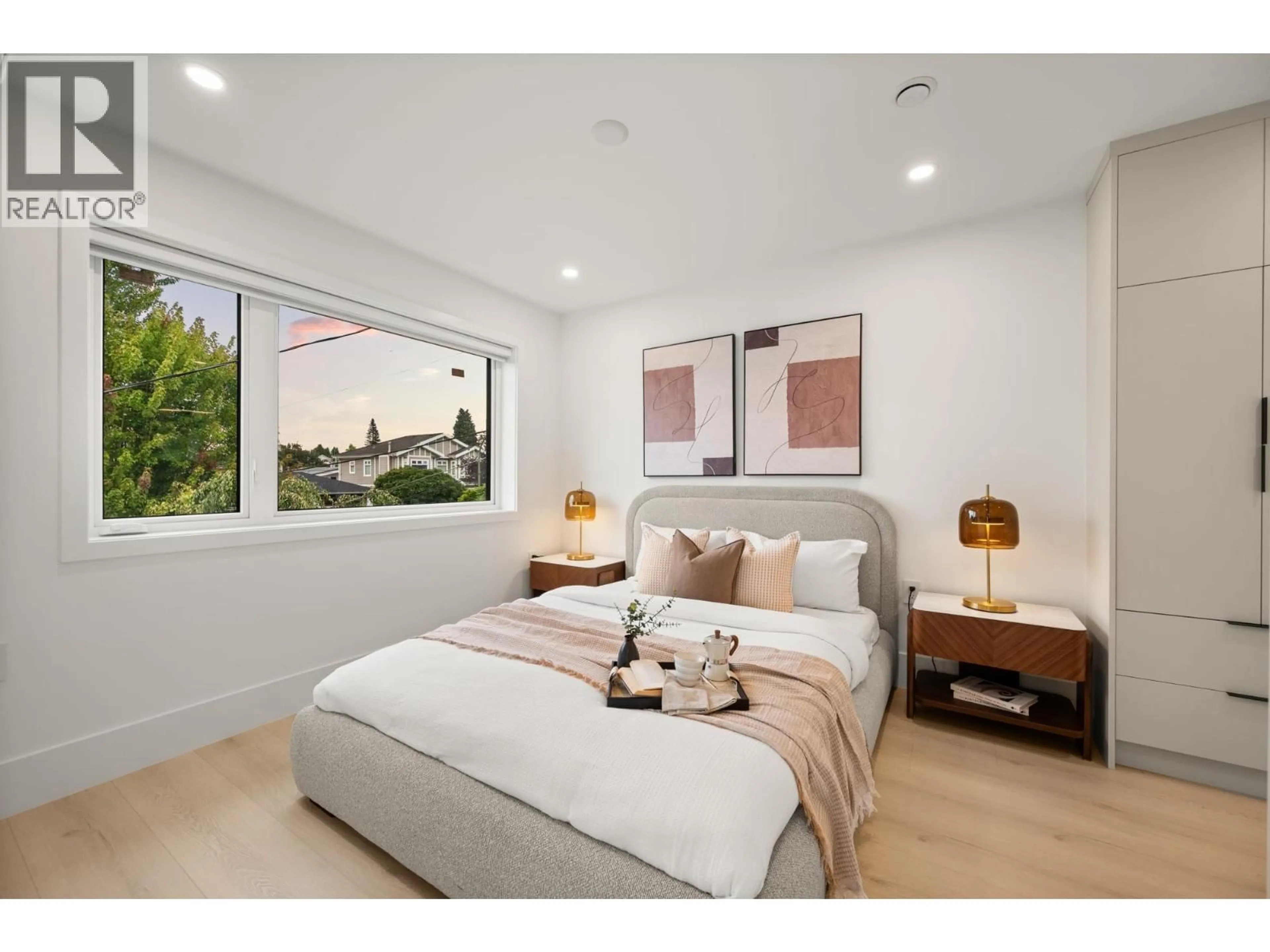 Bedroom with bed, wood/laminate floor for 3430 MONS DRIVE, Vancouver British Columbia V5M3B6
