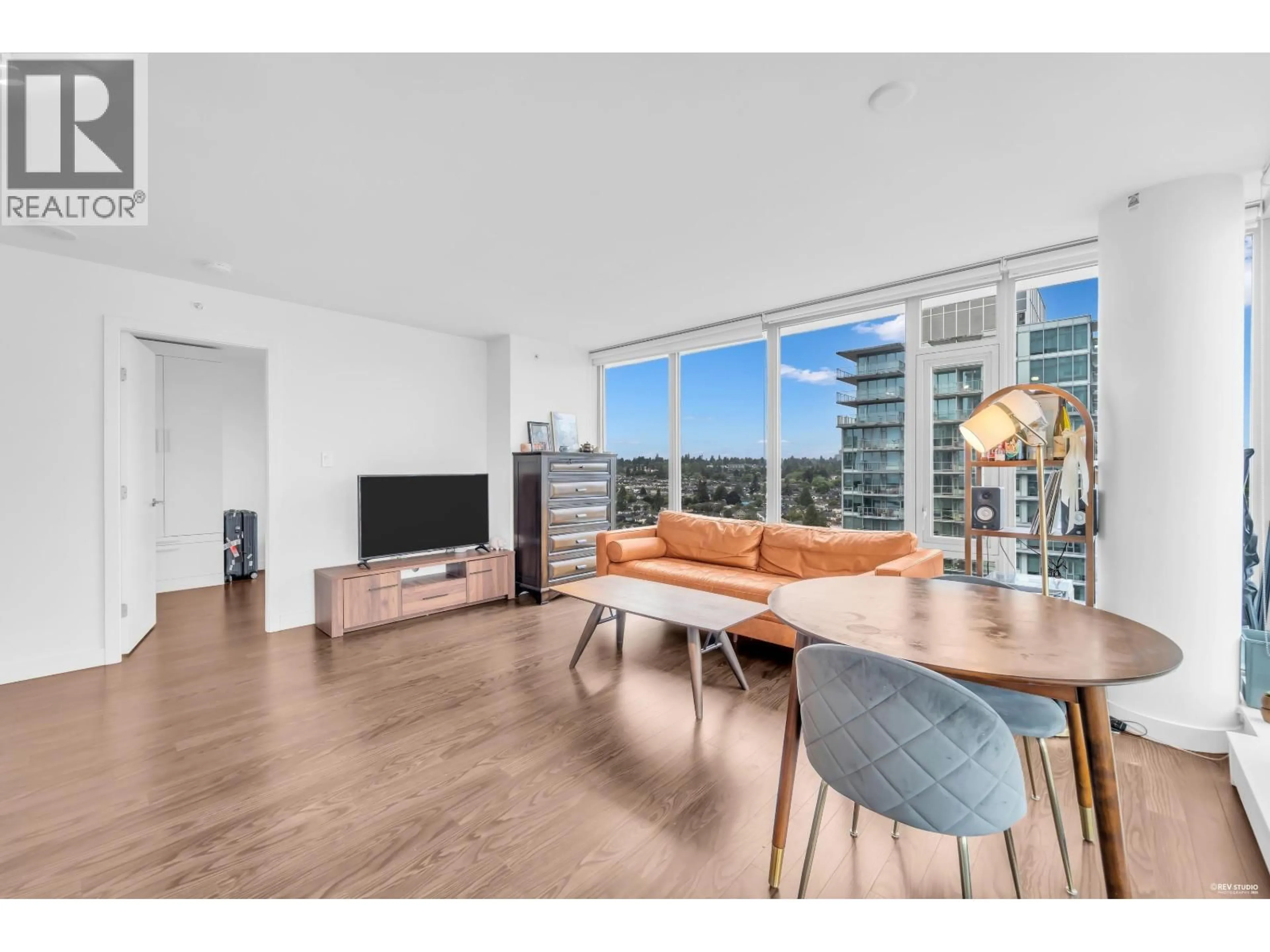 Living room with furniture, wood/laminate floor for 2304 - 8131 NUNAVUT LANE, Vancouver British Columbia V5X0E2