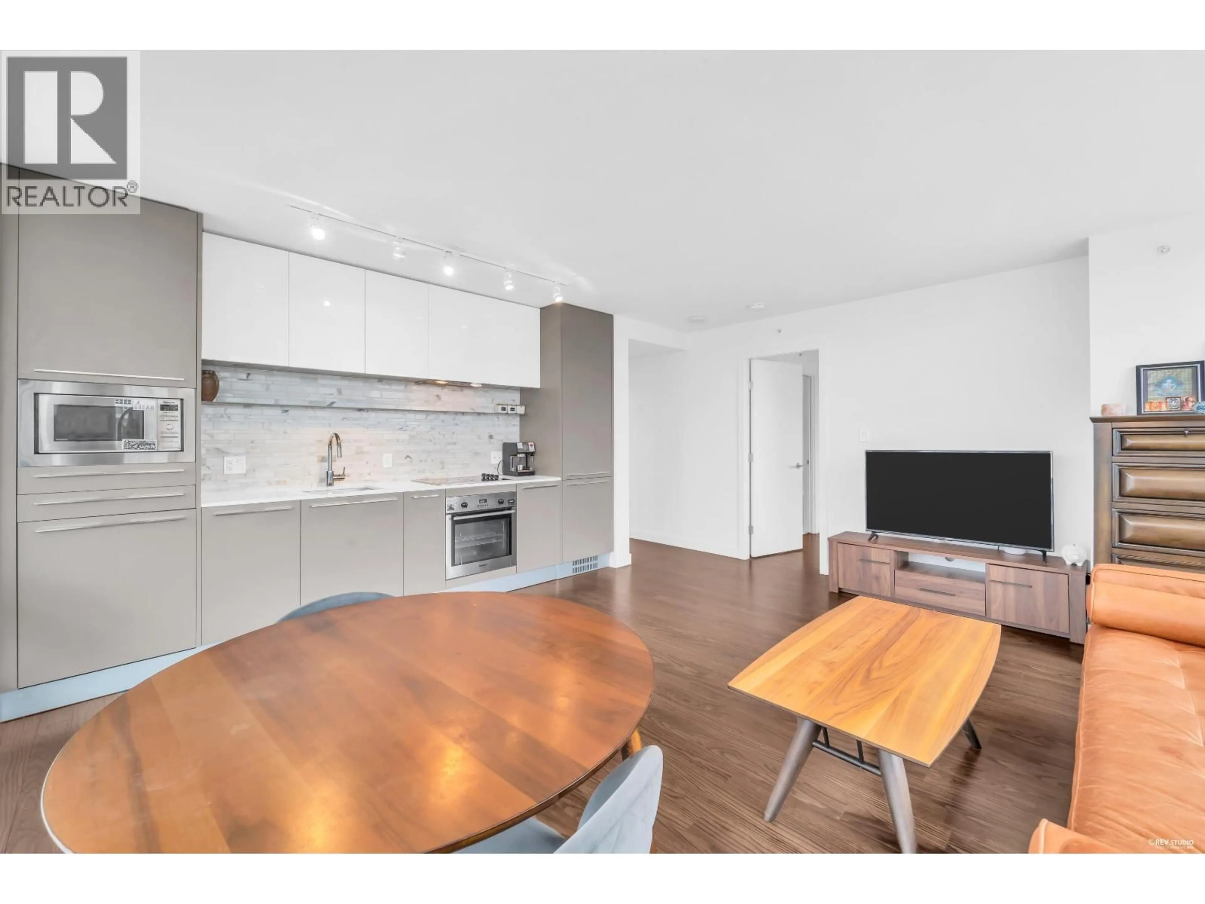 Open concept kitchen, wood/laminate floor for 2304 - 8131 NUNAVUT LANE, Vancouver British Columbia V5X0E2