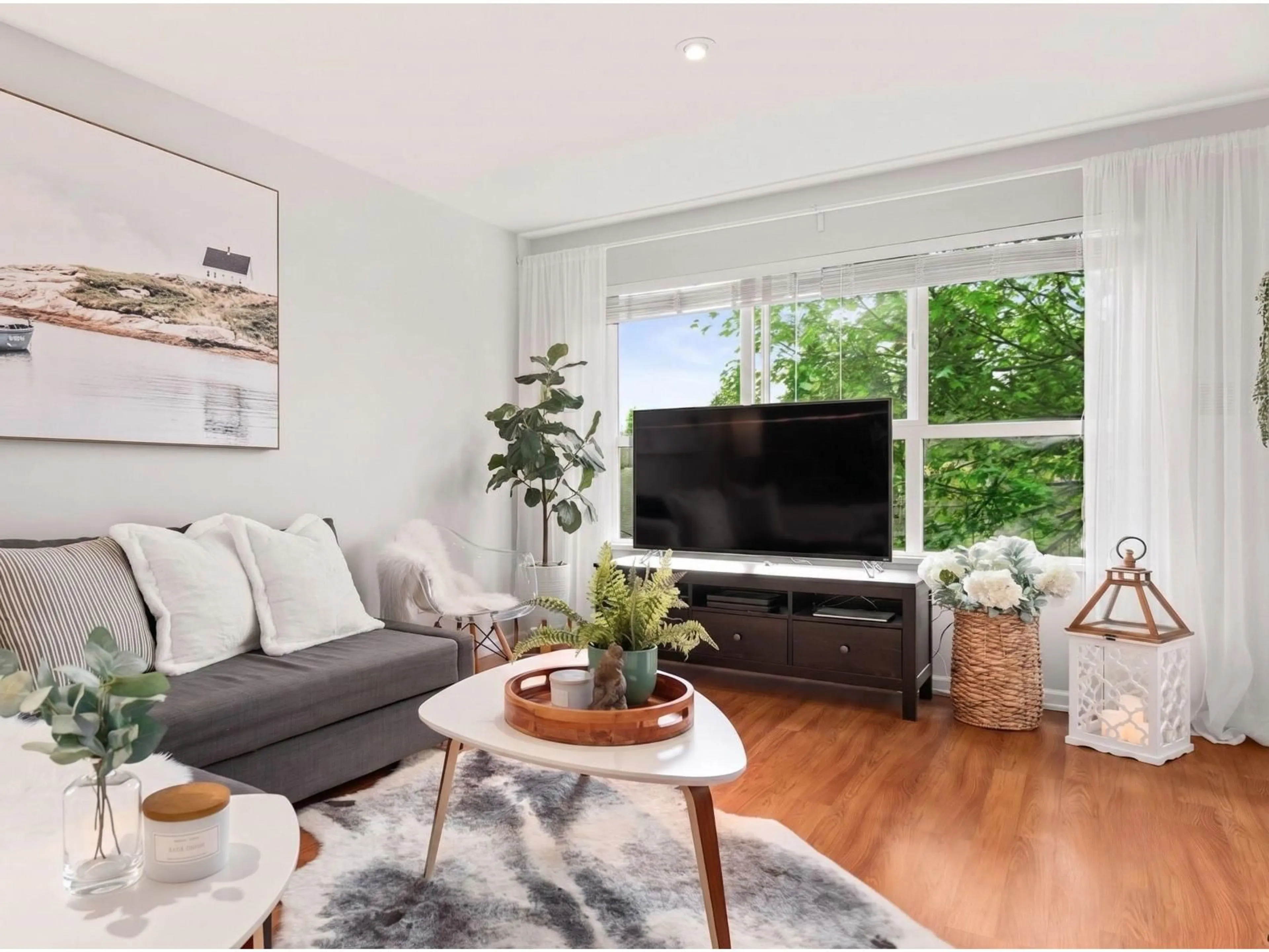 Living room with furniture, wood/laminate floor for 311 - 10188 155 STREET, Surrey British Columbia V3R0R6