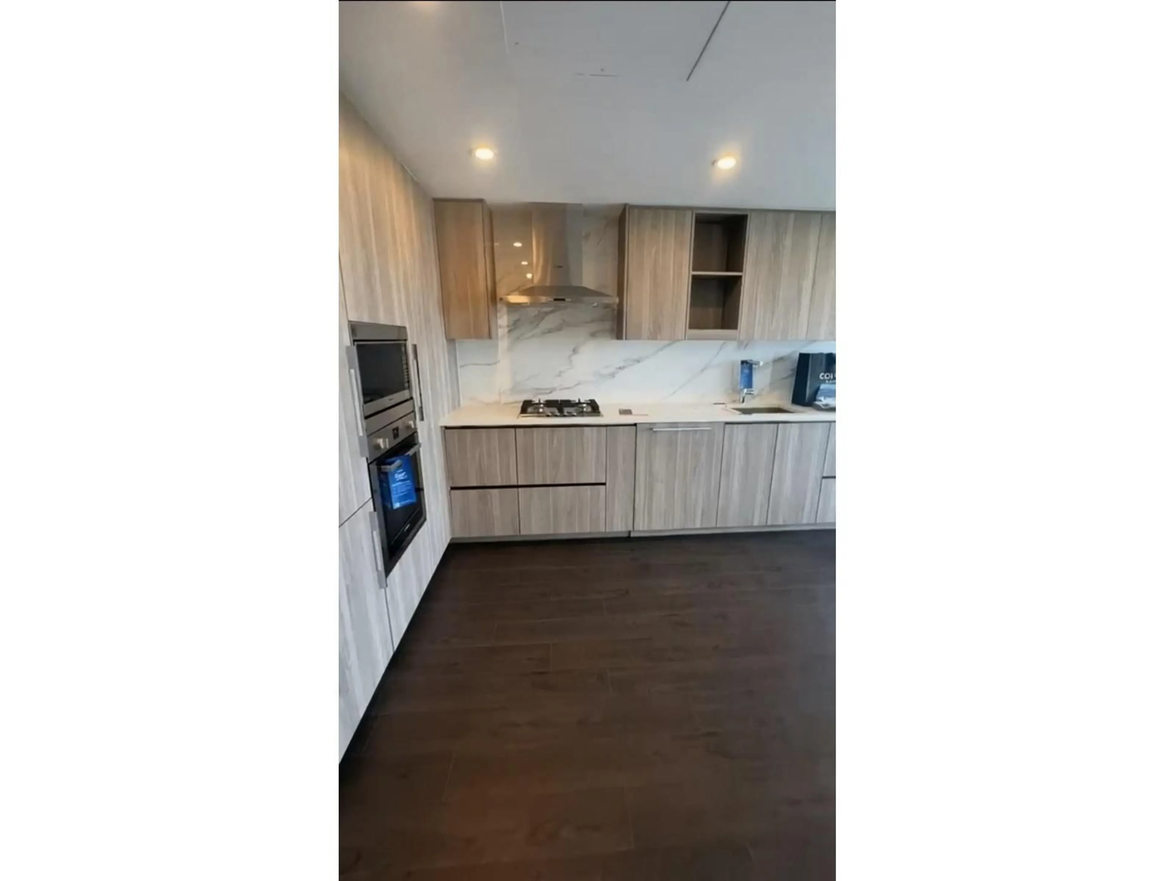 Open concept kitchen, wood/laminate floor for 2201 - 13778 100TH AVENUE, Surrey British Columbia V3T0V3