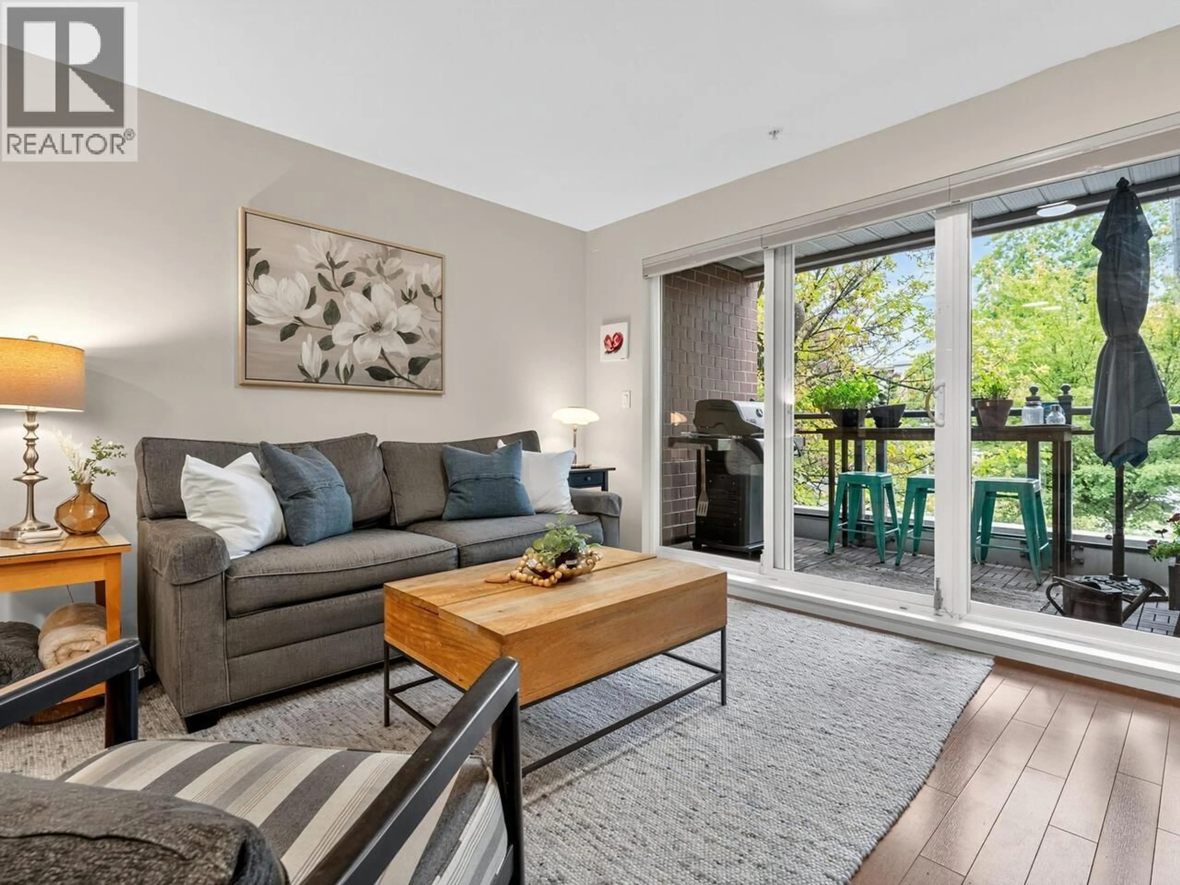Living room with furniture, wood/laminate floor for 206 - 2096 46TH AVENUE, Vancouver British Columbia V6M2K9