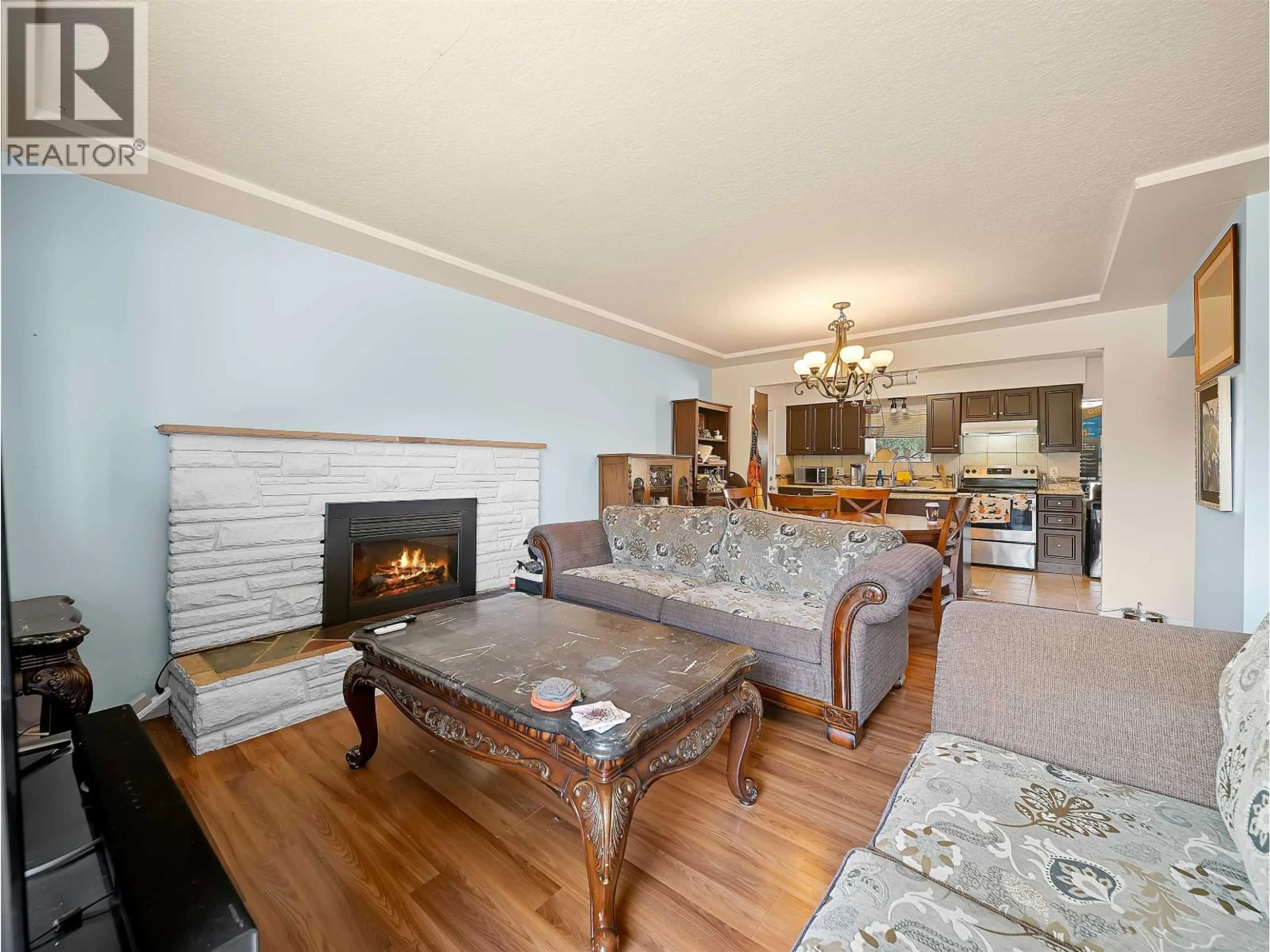 Living room with furniture, wood/laminate floor for 5987 MALVERN AVENUE, Burnaby British Columbia V5E3E7