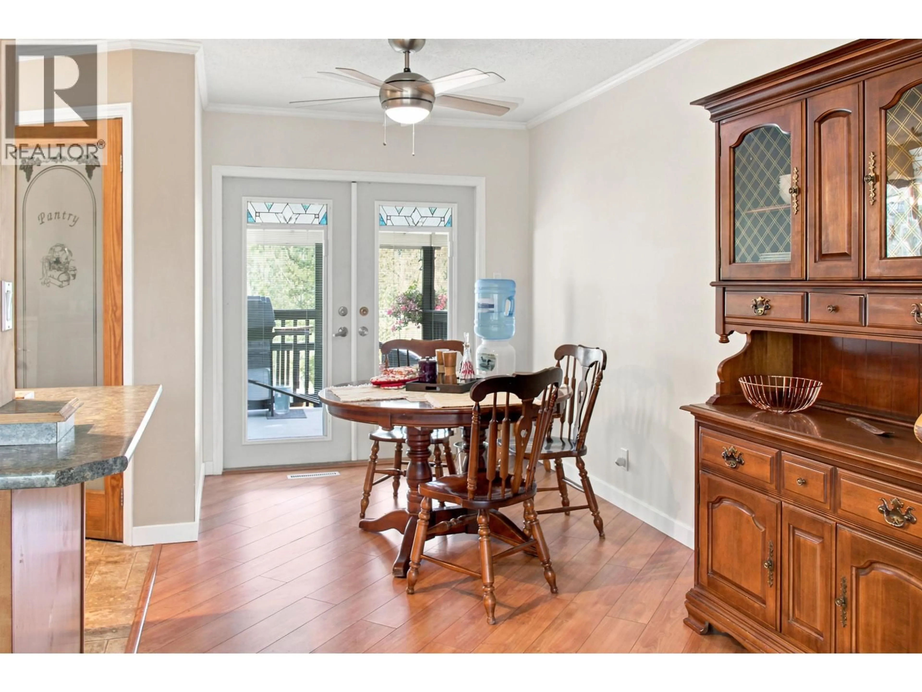 Dining room, wood/laminate floor for 5513 PARK DRIVE, 103 Mile House British Columbia V0K2E1