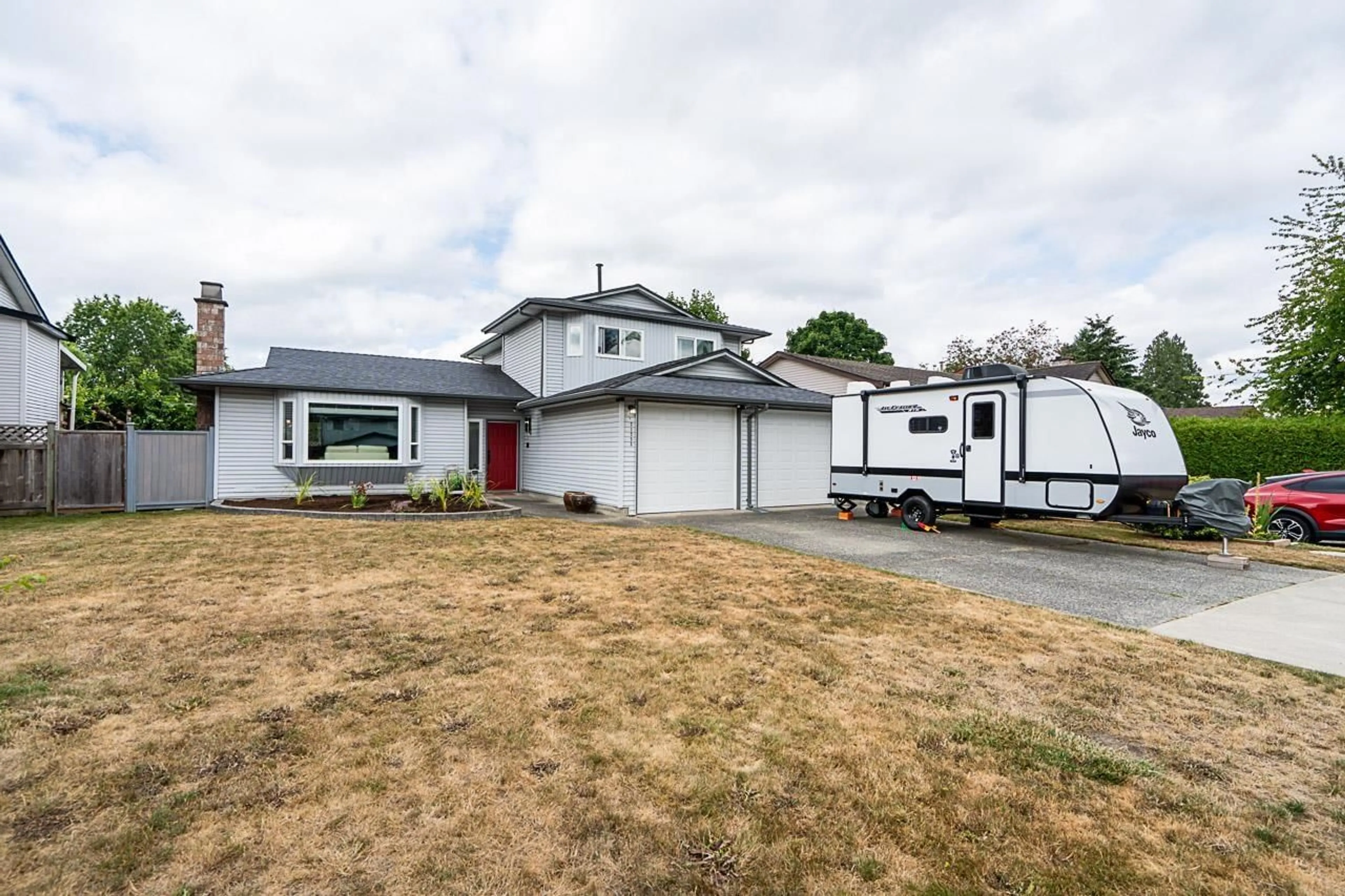 Home with vinyl exterior material, street for 21233 92A AVENUE, Langley British Columbia V1M1K9