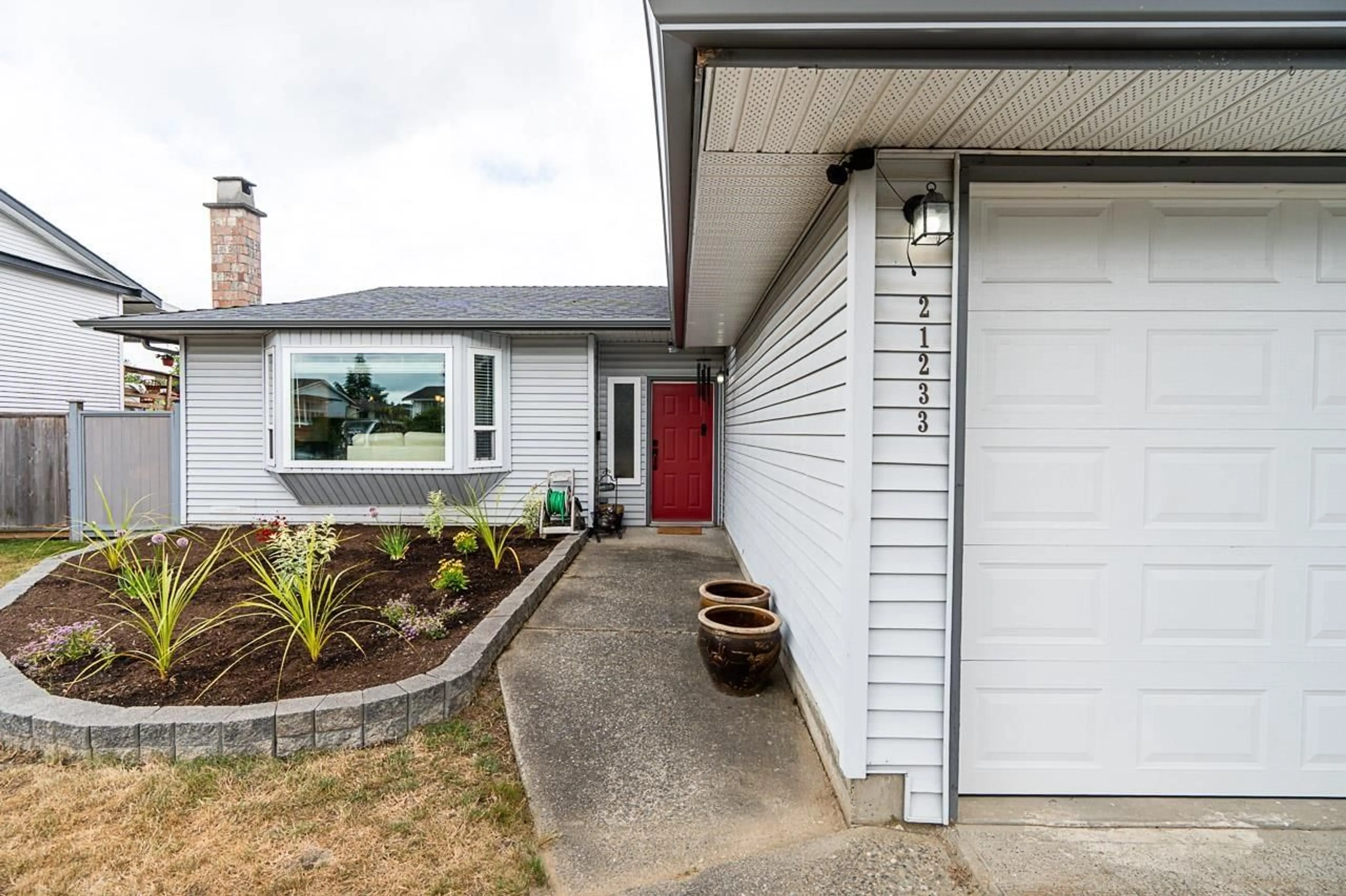 Home with vinyl exterior material, street for 21233 92A AVENUE, Langley British Columbia V1M1K9