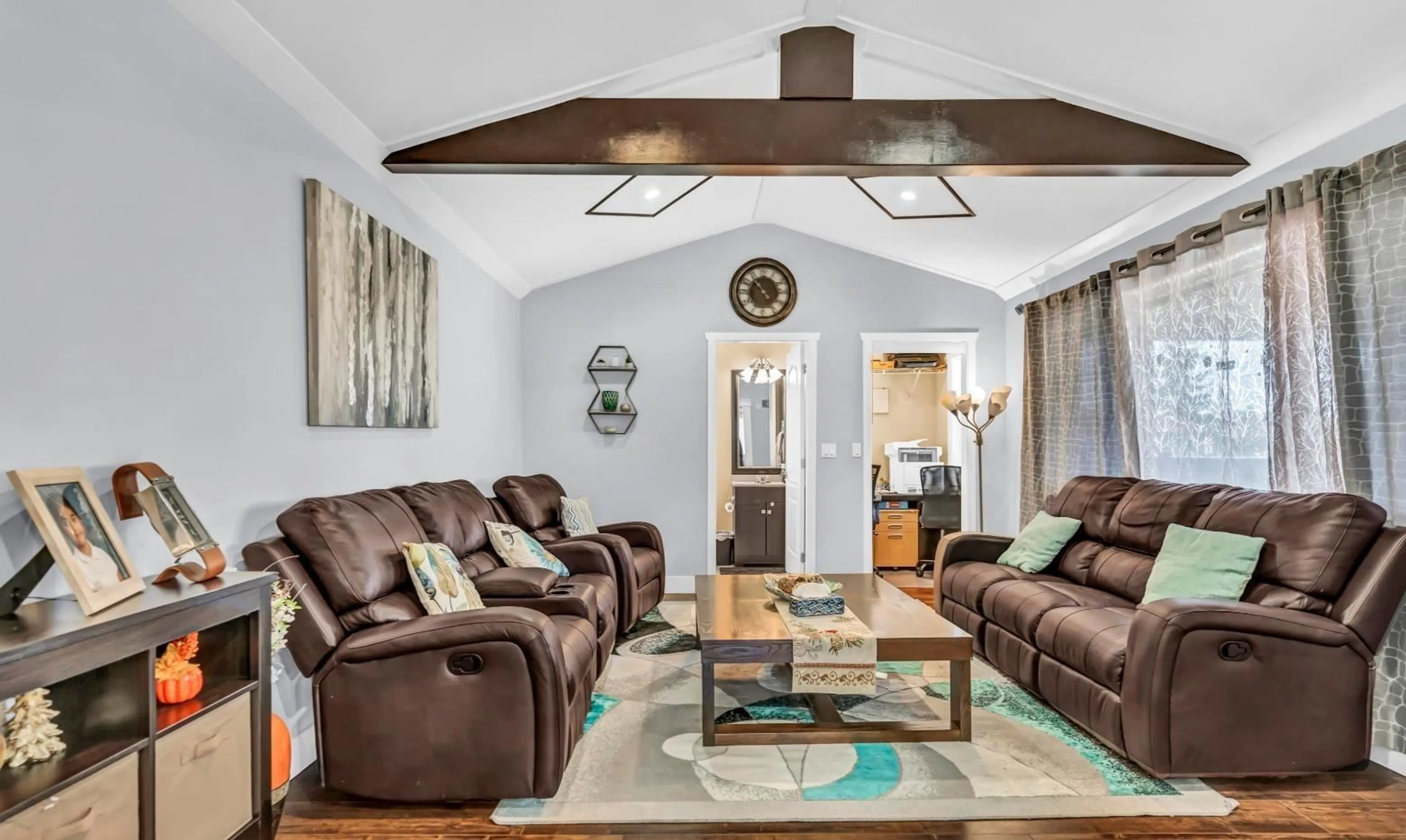 Living room with furniture, wood/laminate floor for 18240 64 AVENUE, Surrey British Columbia V3S8A7