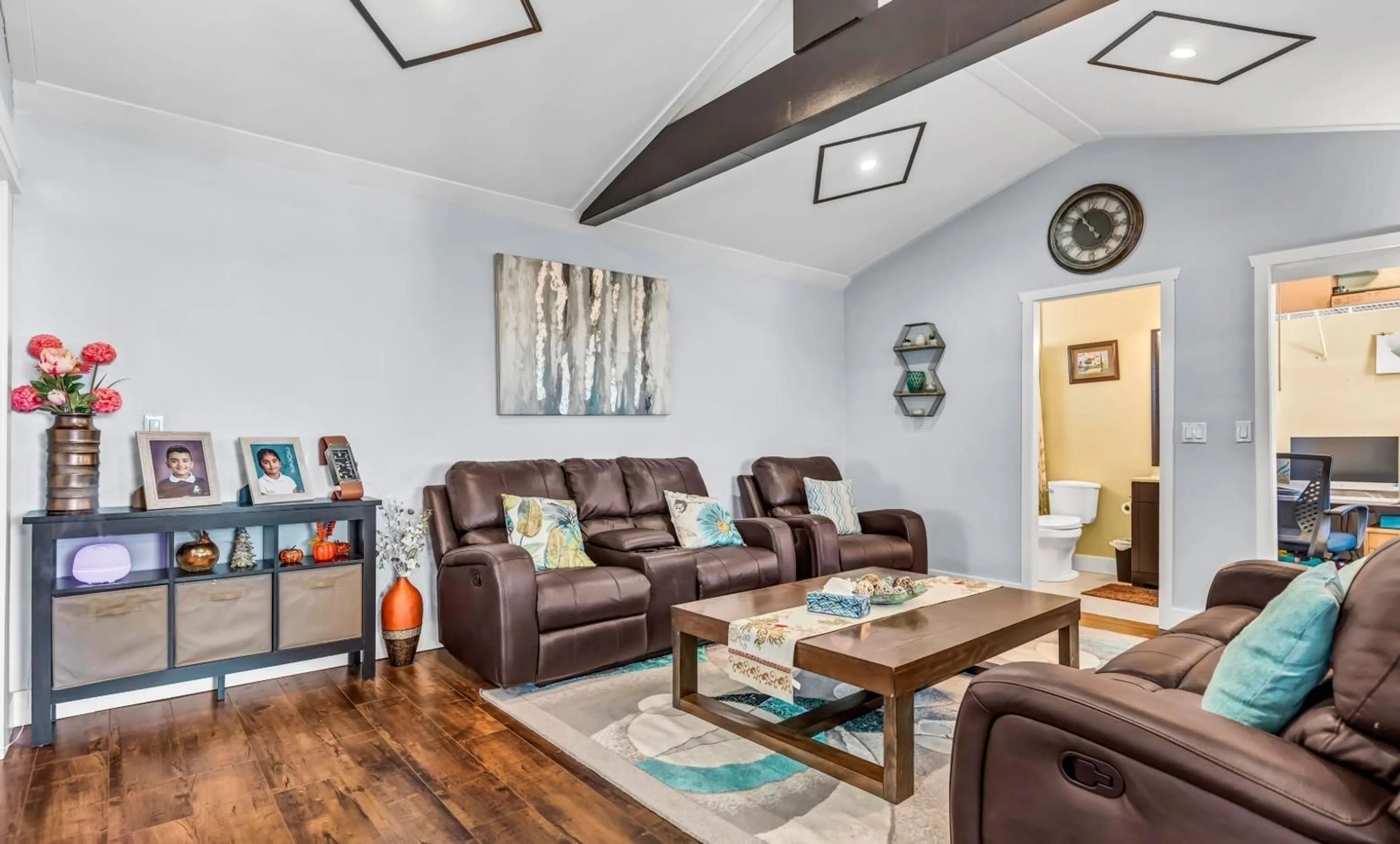 Living room with furniture, wood/laminate floor for 18240 64 AVENUE, Surrey British Columbia V3S8A7