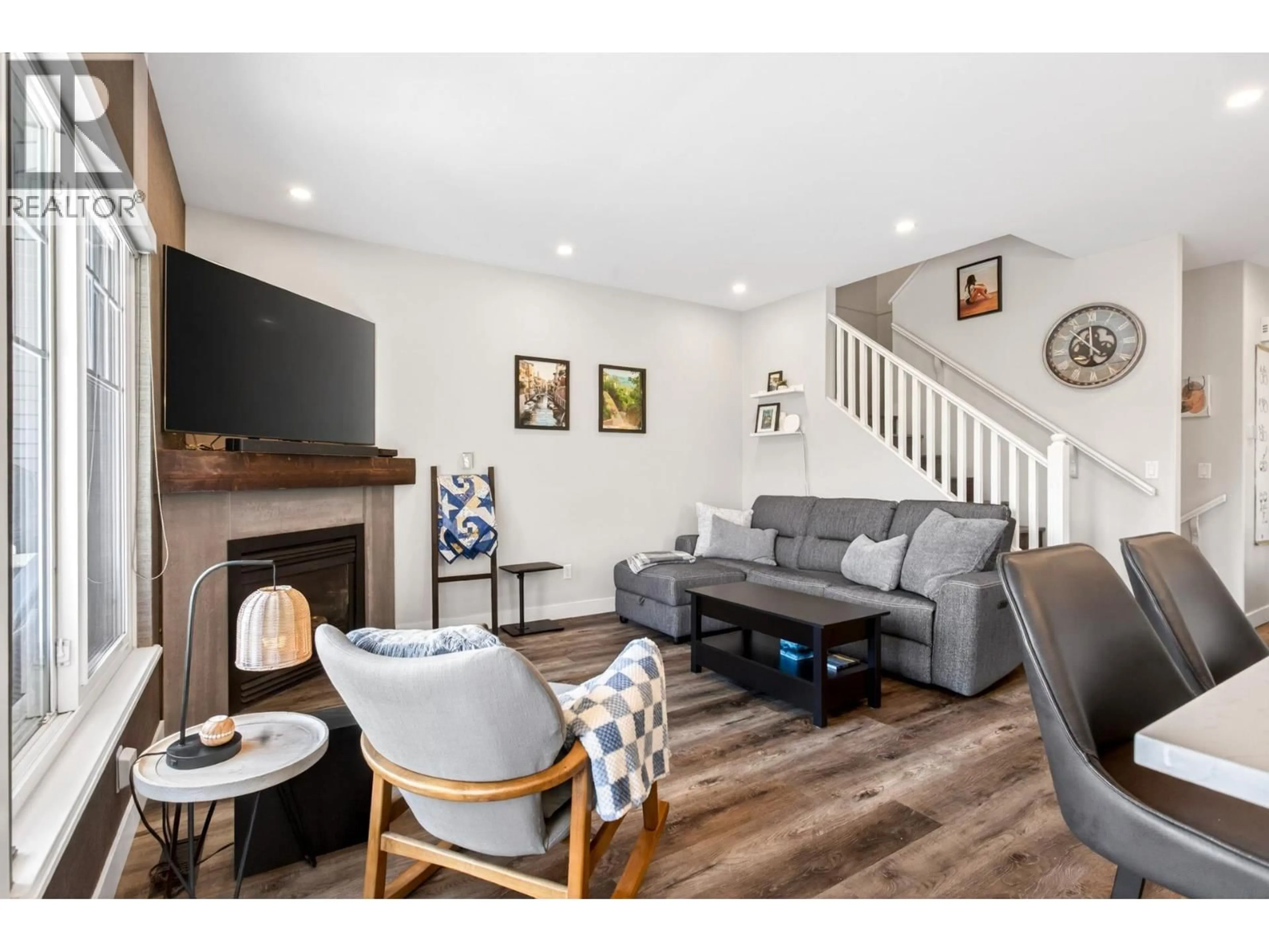 Living room with furniture, wood/laminate floor for 21 - 1751 PADDOCK DRIVE, Coquitlam British Columbia V3E3M2