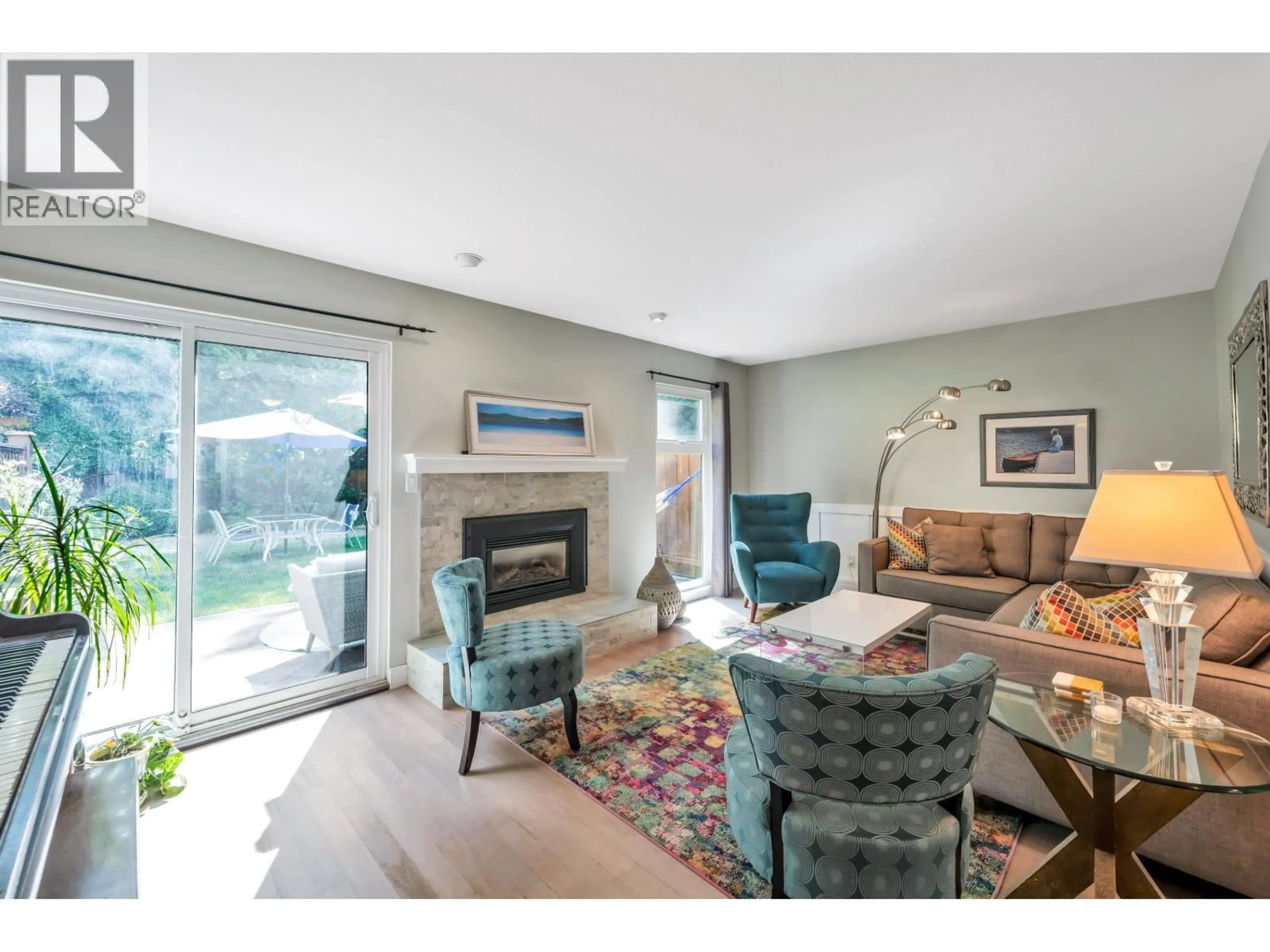 Living room with furniture, wood/laminate floor for 2 - 5600 LADNER TRUNK ROAD, Delta British Columbia V4K1X4