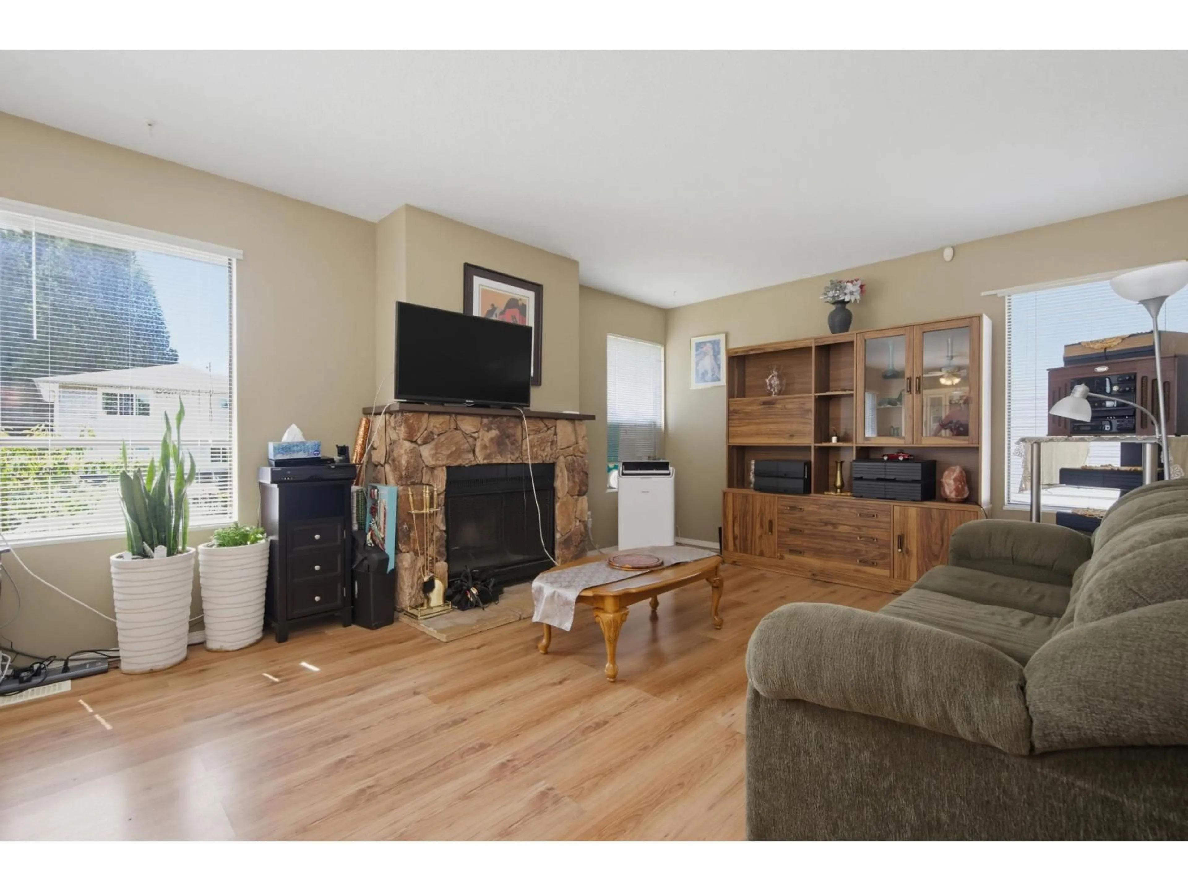 Living room with furniture, wood/laminate floor for 20573 51A AVENUE, Langley British Columbia V3A7A4