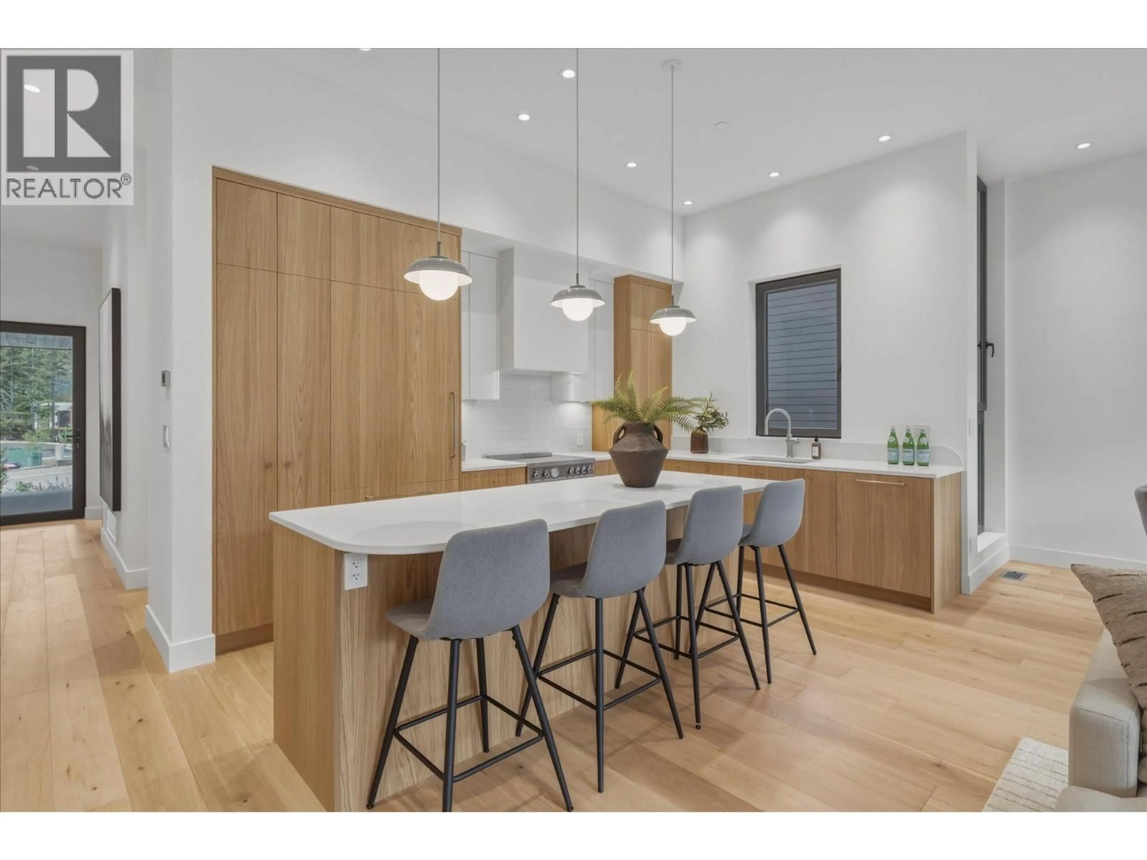 Open concept kitchen, wood/laminate floor for 1702 RIVER RUN PLACE, Whistler British Columbia V8E1P4