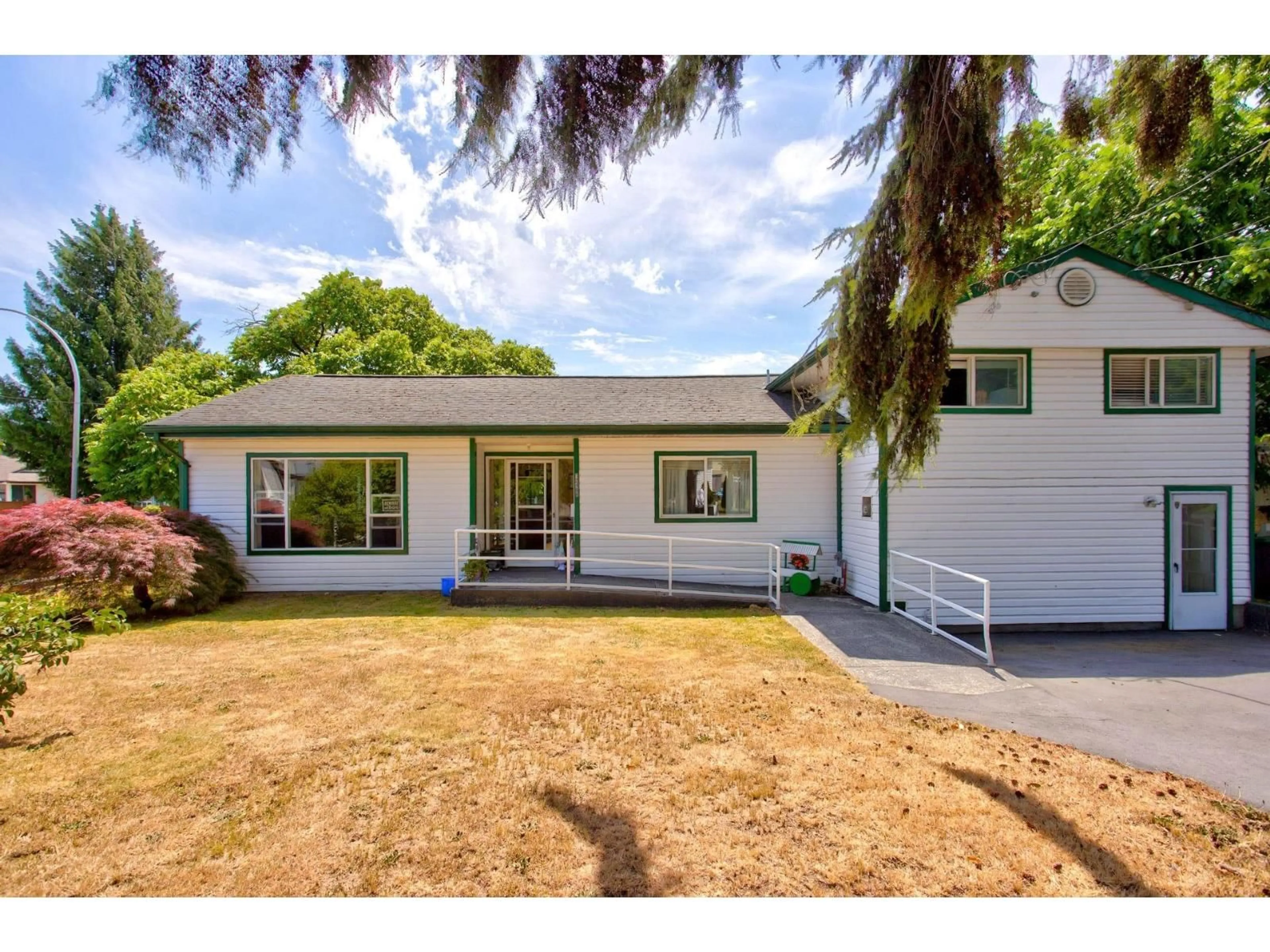Home with vinyl exterior material, street for 12488 92 AVENUE, Surrey British Columbia V3V1G5
