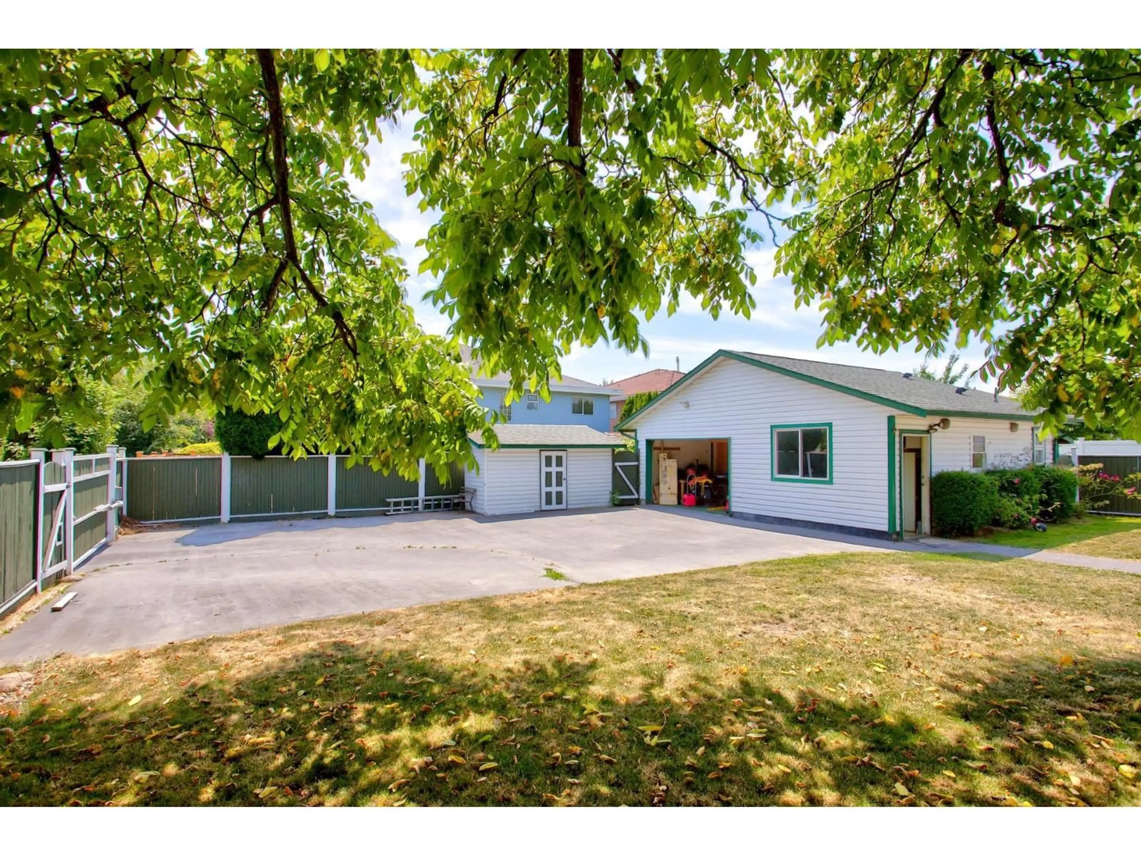 A pic from outside/outdoor area/front of a property/back of a property/a pic from drone, street for 12488 92 AVENUE, Surrey British Columbia V3V1G5