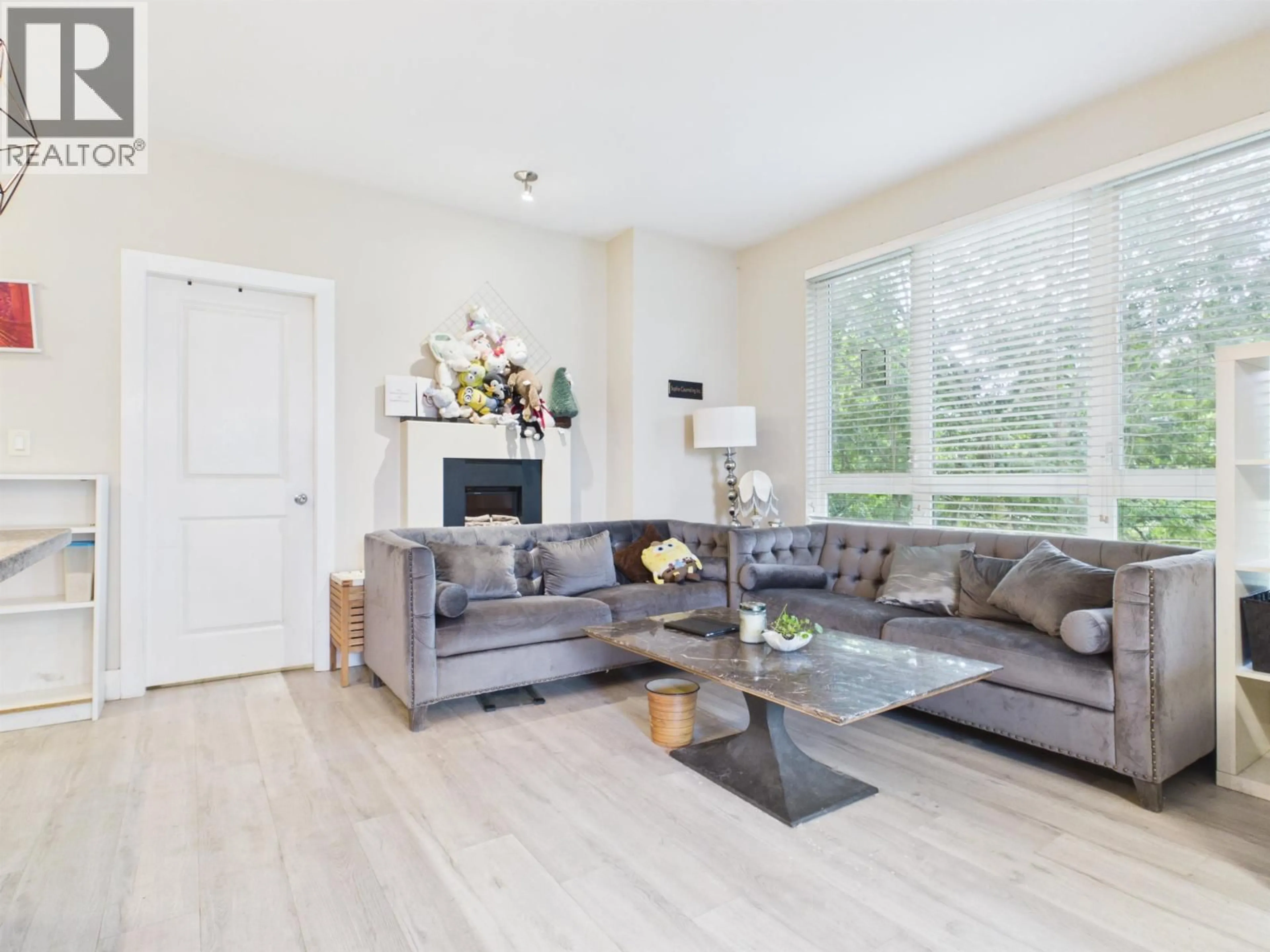 Living room with furniture, wood/laminate floor for 208 - 8400 ANDERSON ROAD, Richmond British Columbia V6Y1S6