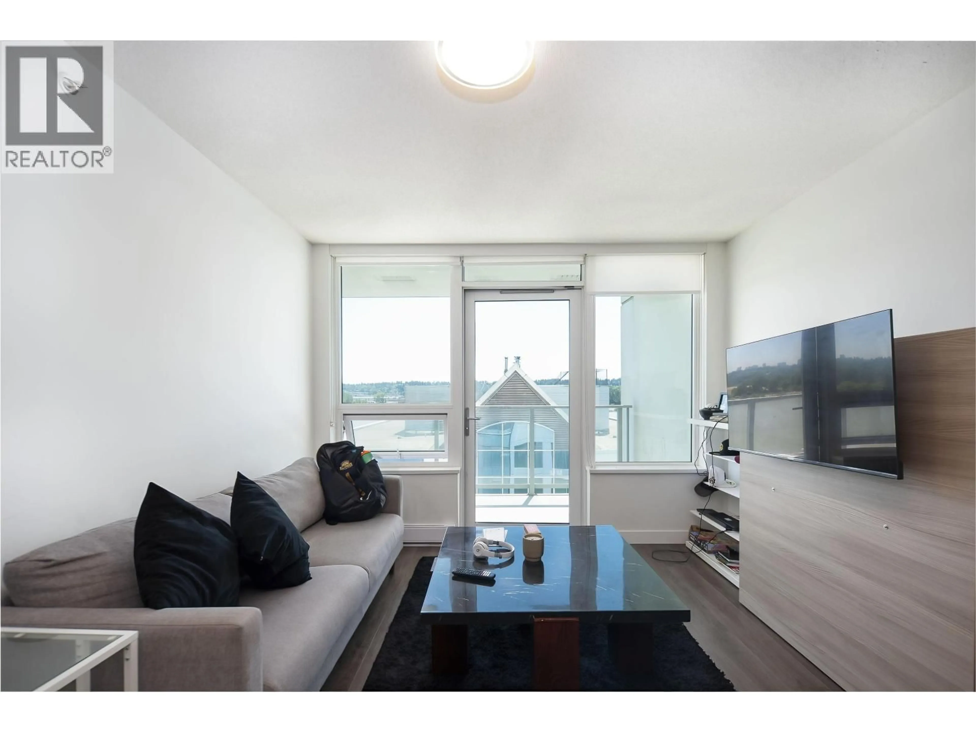 Living room with furniture, wood/laminate floor for 710 - 988 QUAYSIDE DRIVE, New Westminster British Columbia V3M0L5