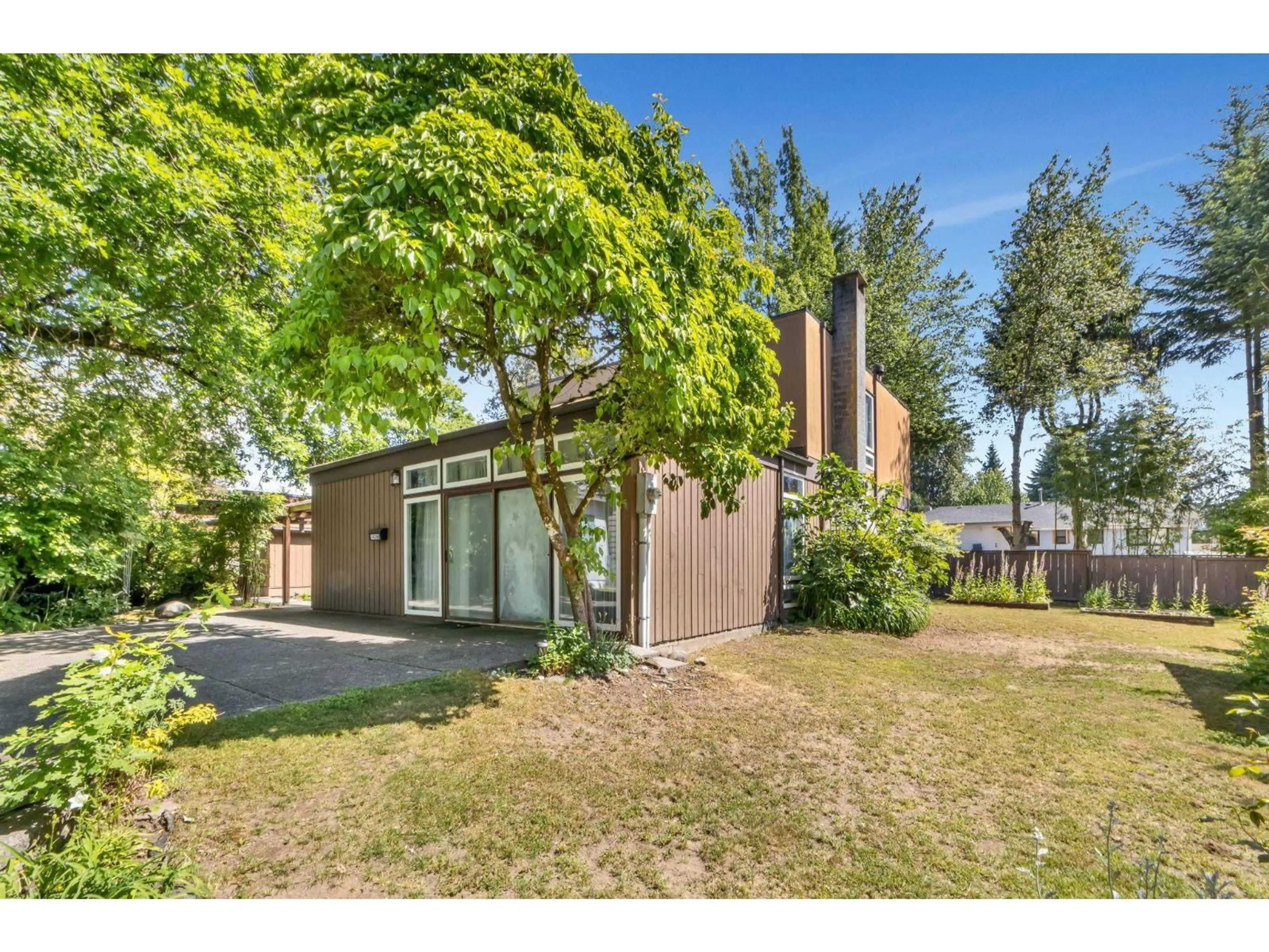 A pic from outside/outdoor area/front of a property/back of a property/a pic from drone, street for 14246 102 AVENUE, Surrey British Columbia V3T5A5