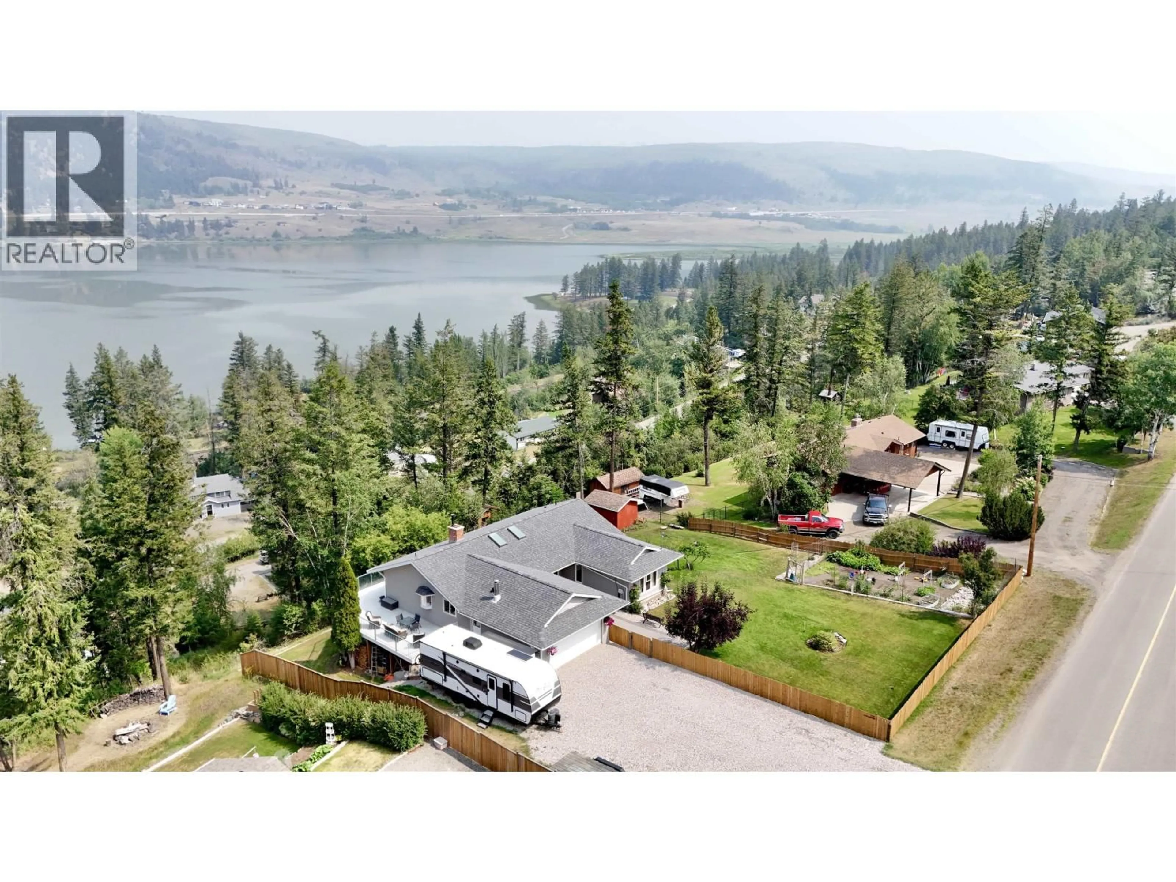 A pic from outside/outdoor area/front of a property/back of a property/a pic from drone, water/lake/river/ocean view for 2116 LAKESIDE DRIVE, Williams Lake British Columbia V2G5G4