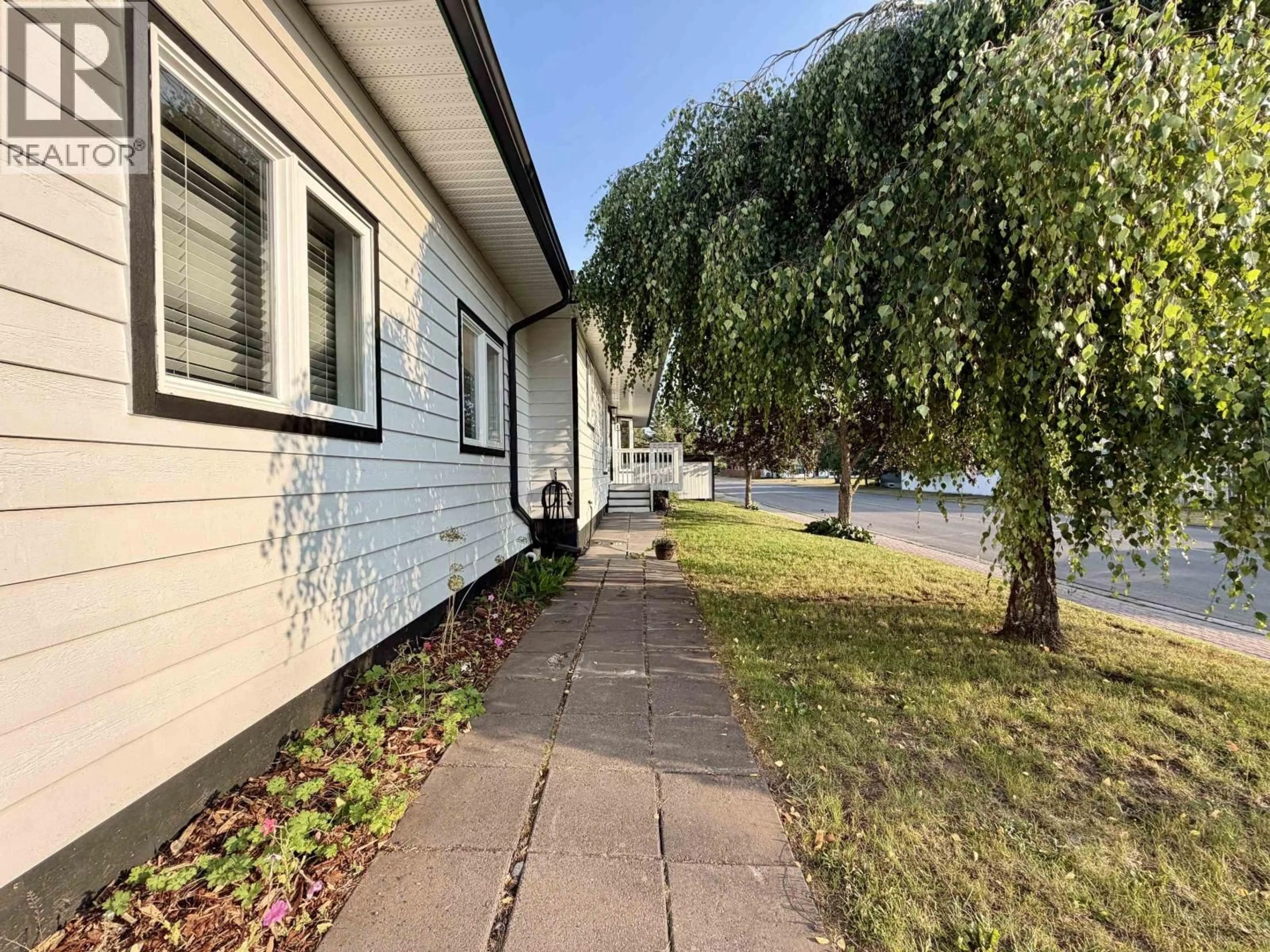 A pic from outside/outdoor area/front of a property/back of a property/a pic from drone, street for 1411 DRIFTWOOD CRESCENT, Smithers British Columbia V0J2N0