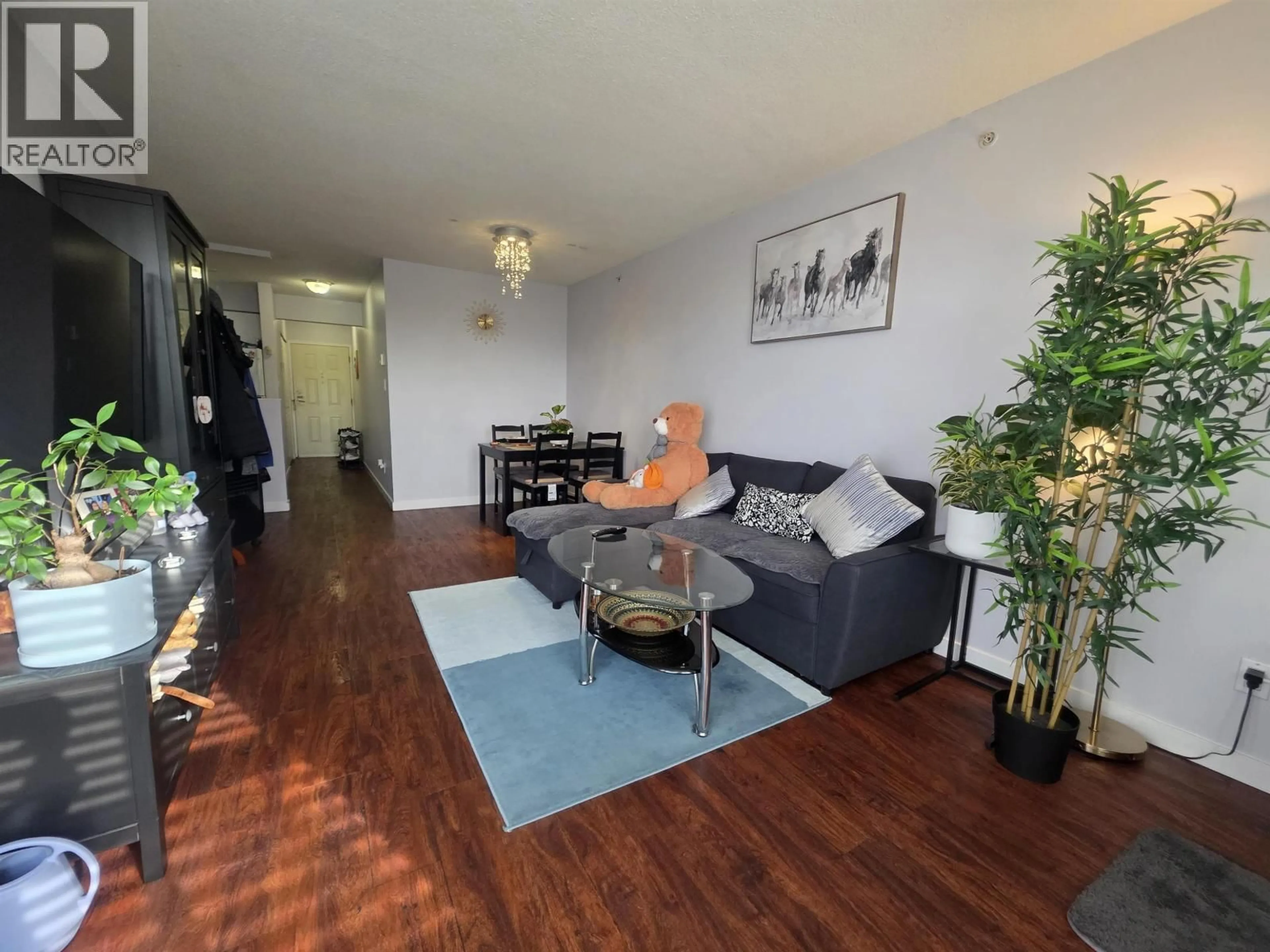 Living room with furniture, wood/laminate floor for 607 - 3455 ASCOT PLACE, Vancouver British Columbia V5R6B7