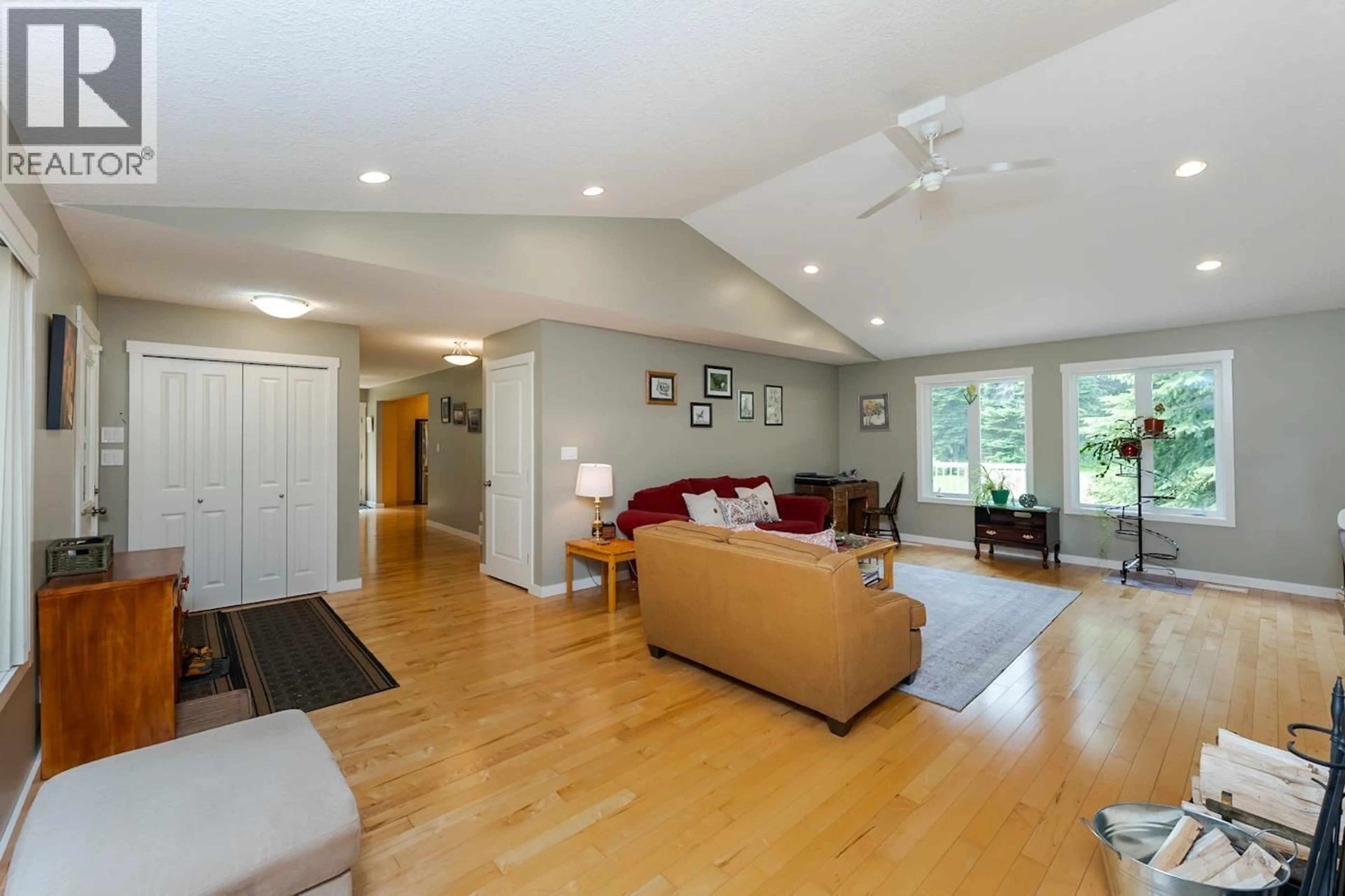 Living room with furniture, wood/laminate floor for 8905 CHRISTINA ROAD, Prince George British Columbia V2K5J4