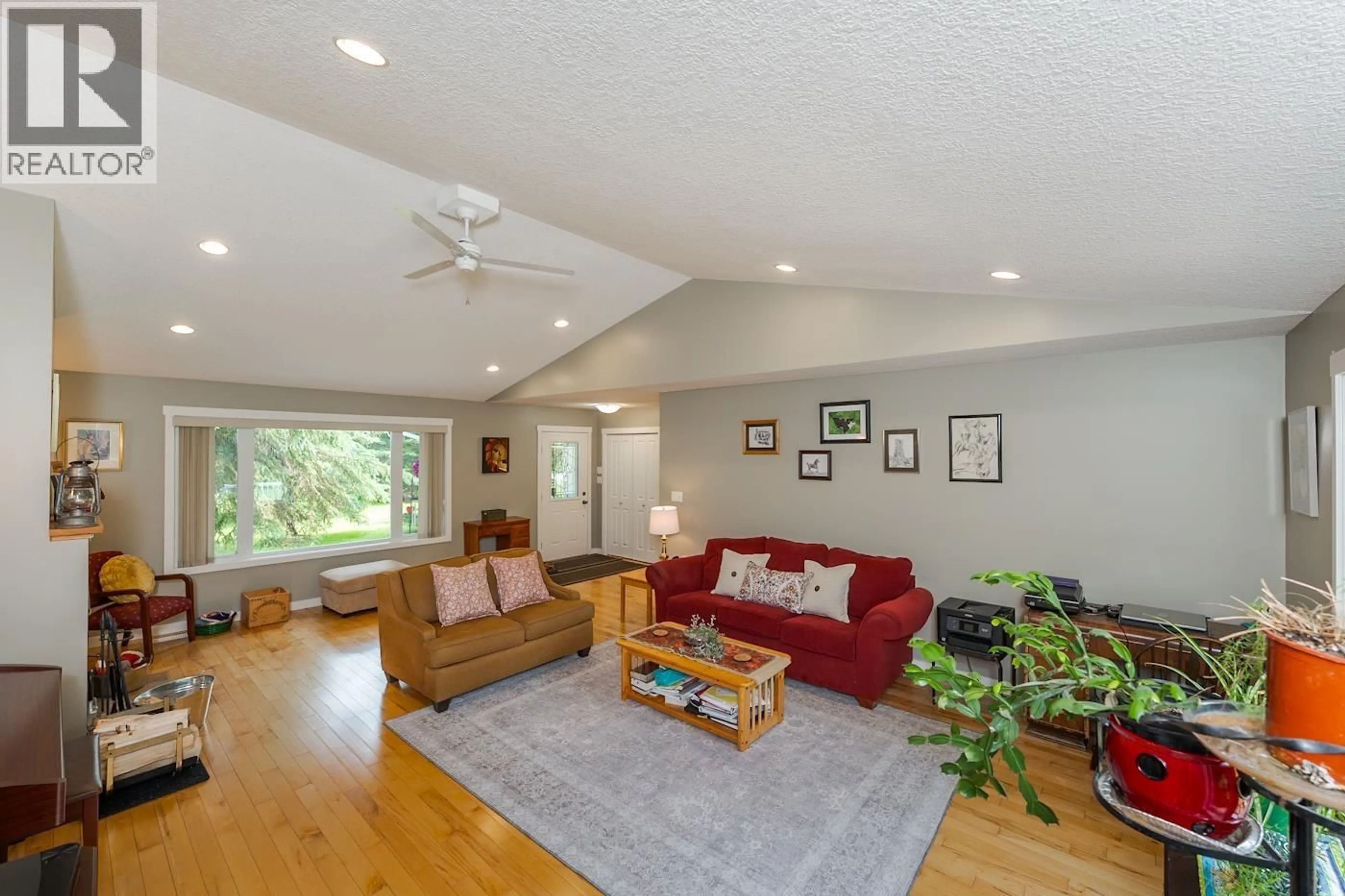 Living room with furniture, wood/laminate floor for 8905 CHRISTINA ROAD, Prince George British Columbia V2K5J4