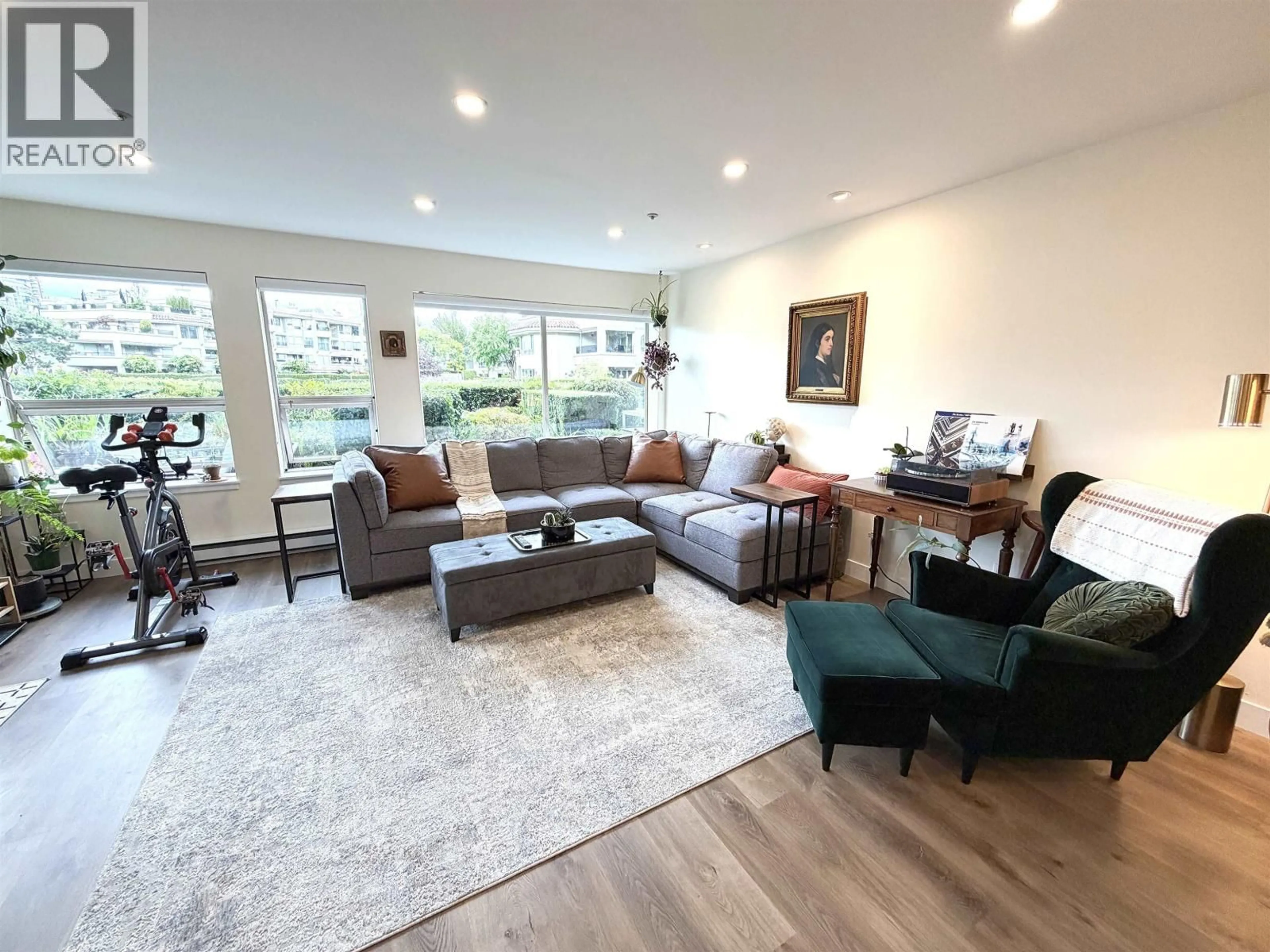 Living room with furniture, wood/laminate floor for 118 - 525 WHEELHOUSE SQUARE, Vancouver British Columbia V5Z4L8