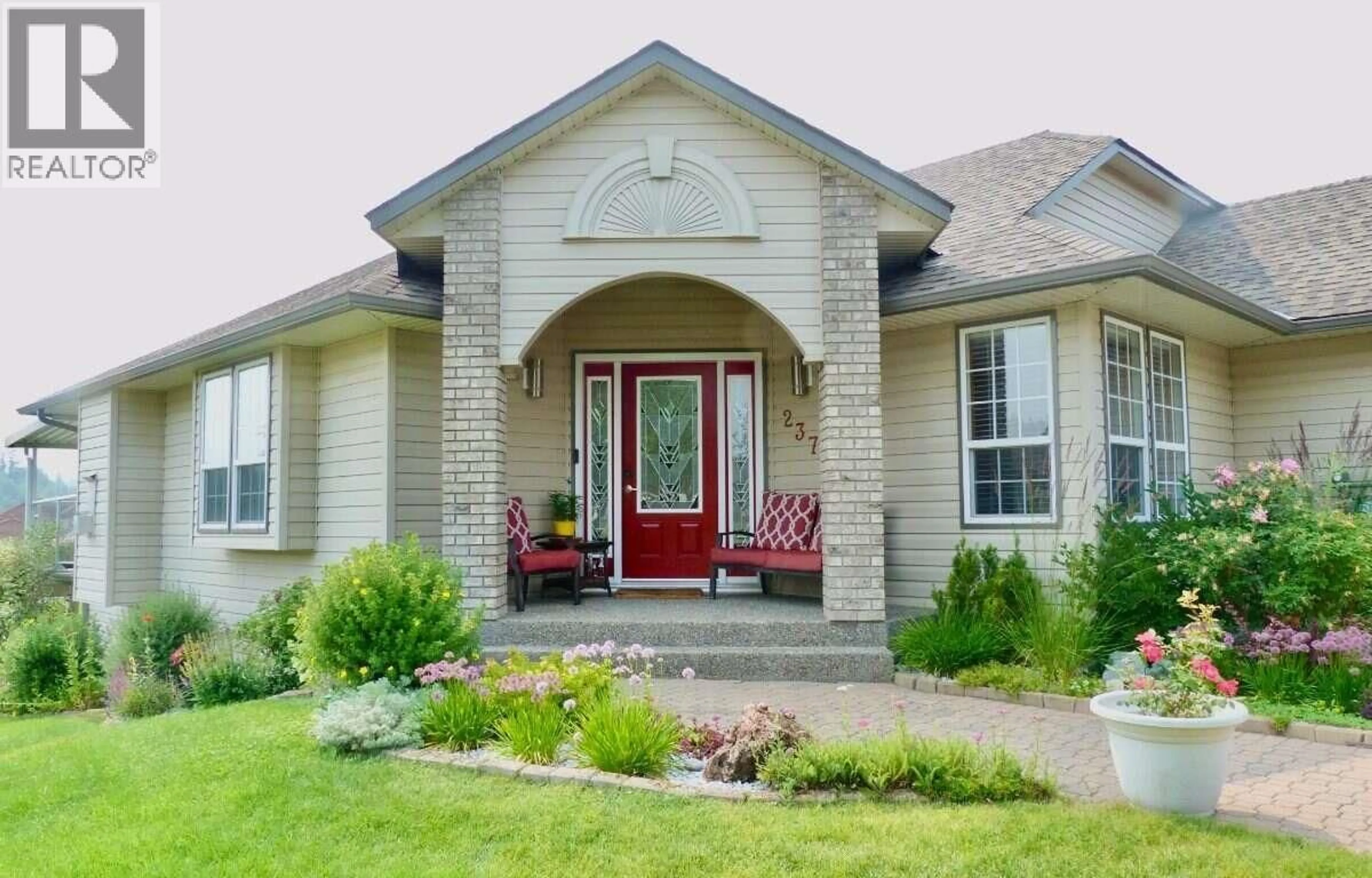 Home with brick exterior material, street for 2379 MCTAVISH ROAD, Prince George British Columbia V2K5R5