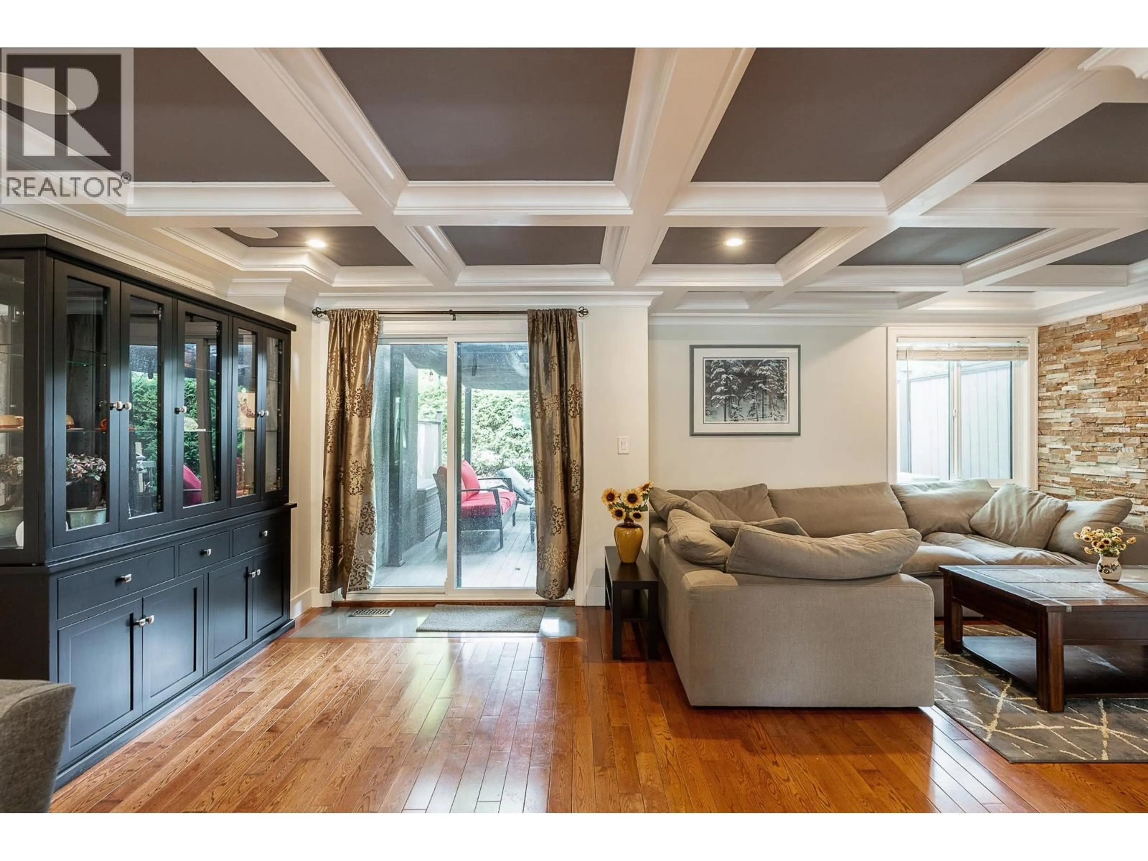 Living room with furniture, wood/laminate floor for 8514 WOODTRAIL PLACE, Burnaby British Columbia V5A4A9